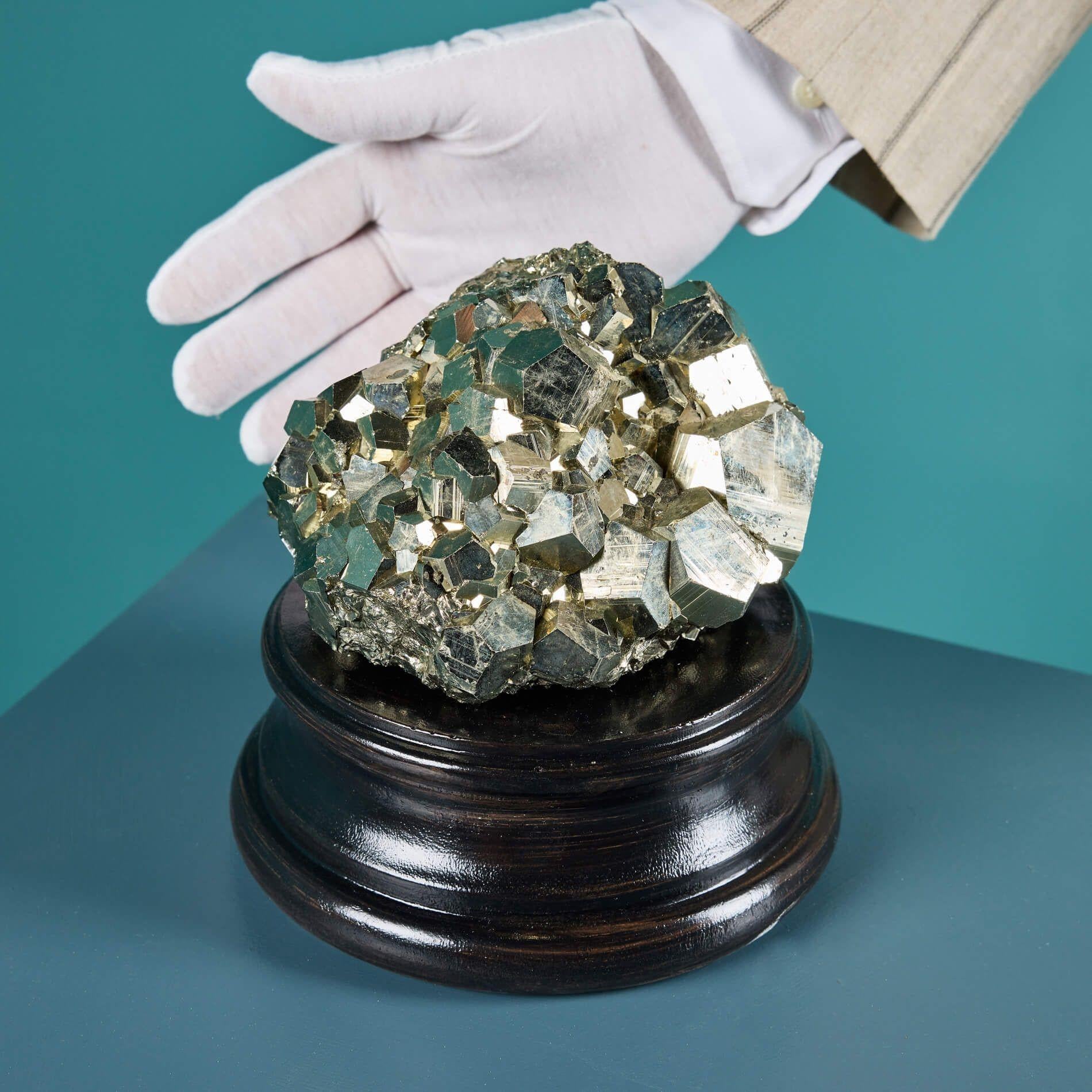 A large natural pyrite specimen originating from Peru, sourced from the ex private collection of a Scottish professor.

This mineral has a lustrous exterior that catches the light beautifully with its unique well-terminated cube like crystals and