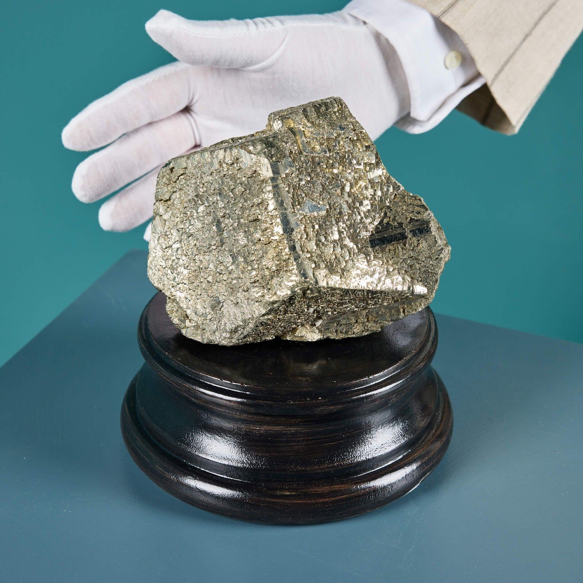 A large natural pyrite of an unusual form sourced from the ex UK private collection.

This native British mineral has a lustrous exterior that catches the light beautifully.

Naturally formed over millions of years, this striking mineral specimen