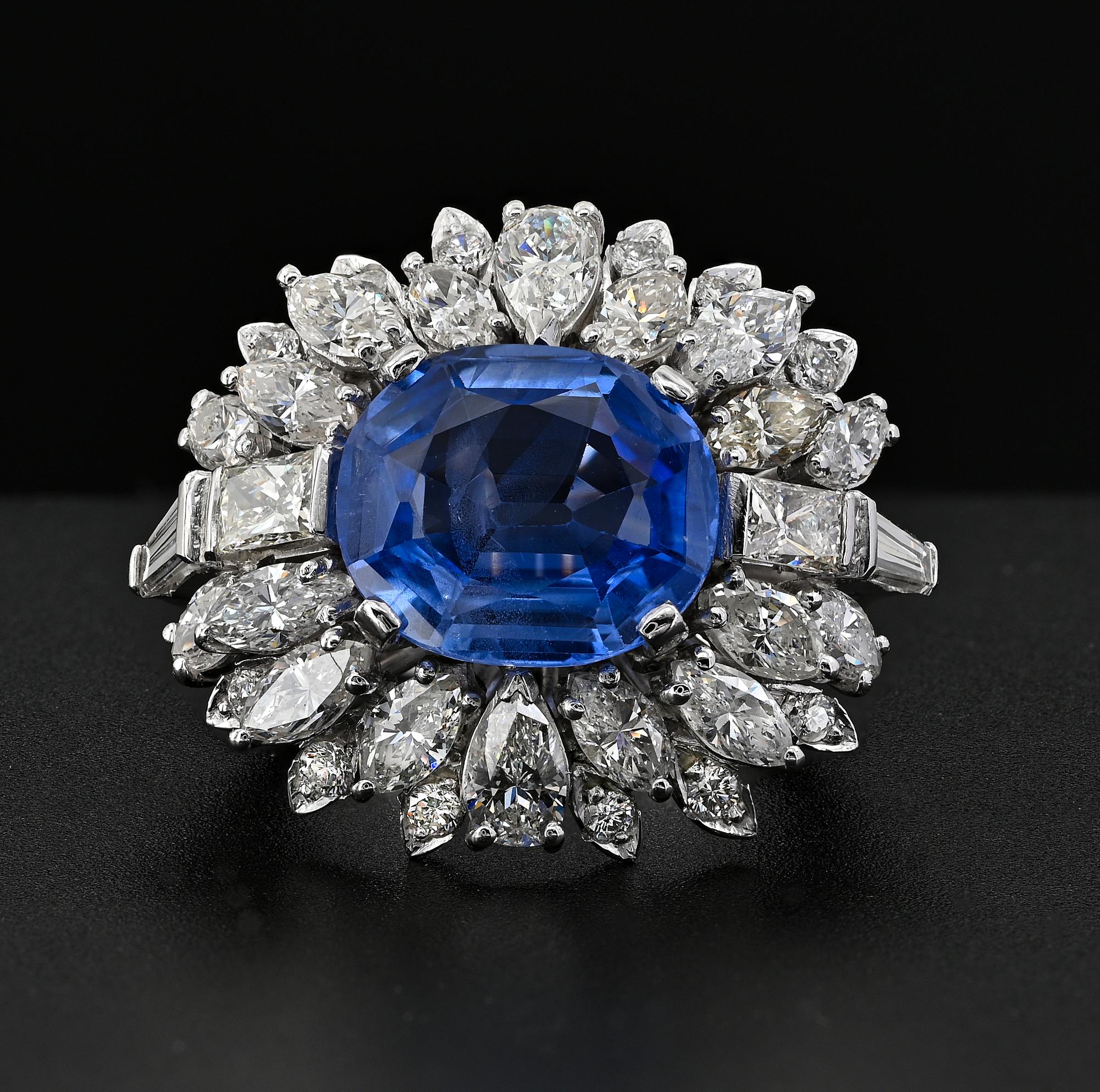 An impressive Diamond and sapphire cocktail ring.
Large crown beautifully designed and hand crafted of Platinum during the 60’s.
Boasting a magnificent 7.46 Ct Natural no heat Sapphire Ceylon origin – fully certified by GCS London. Stunning corn