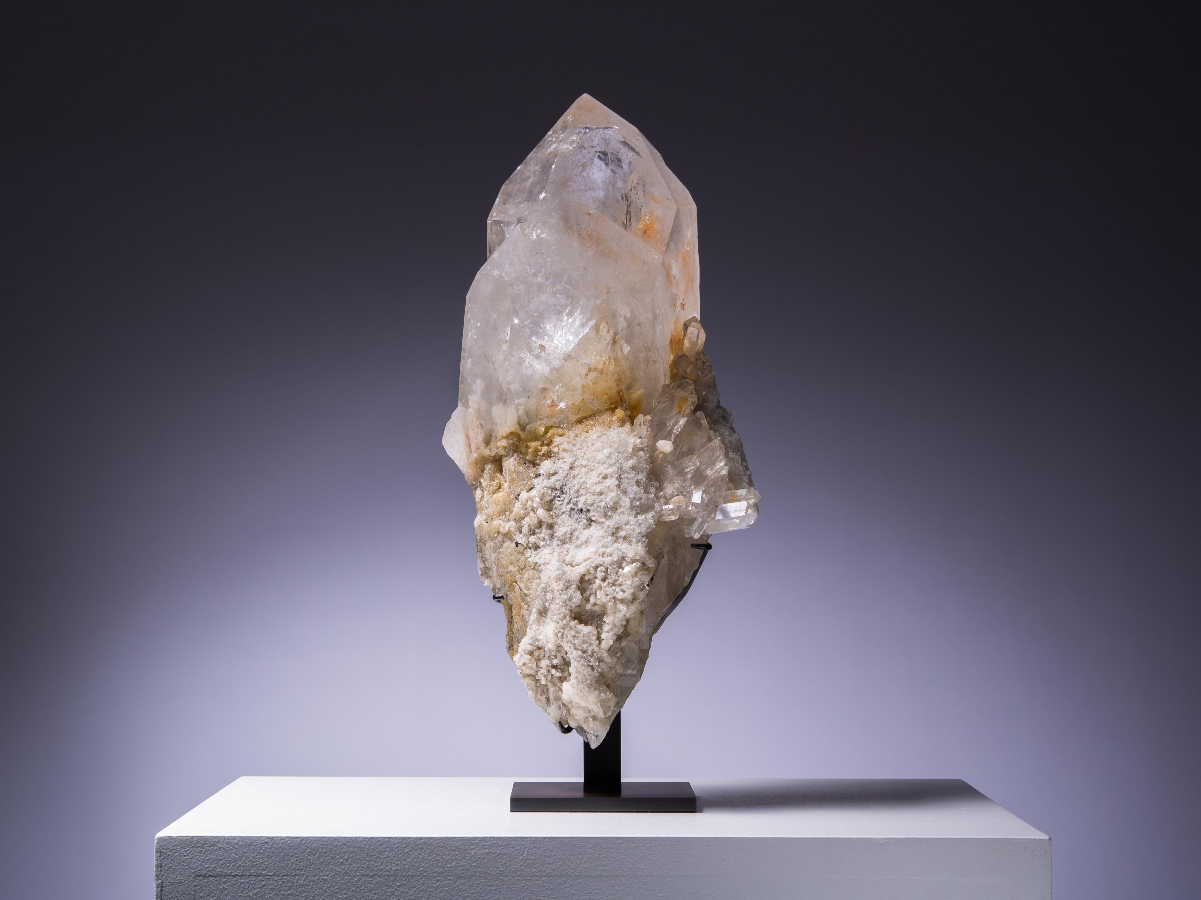 This gorgeous large quartz crystal sits on a bed of rough crystalline matrix.
A large piece is wonderfully sculptural.

This piece was legally and ethically sourced.
Place of origin: Brazil.