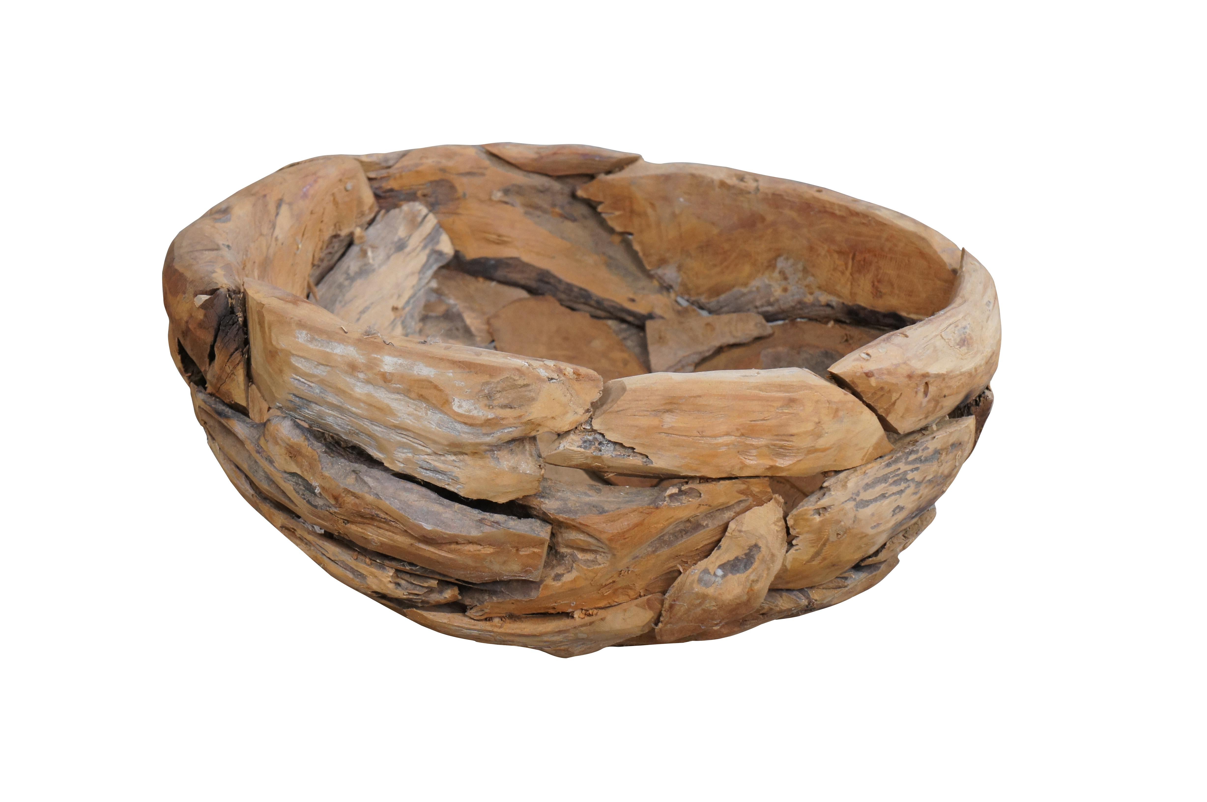 Reclaimed Teak wood bowl or planter. Pieced together from driftwood with a beautiful shape and form.

Dimensions:
24