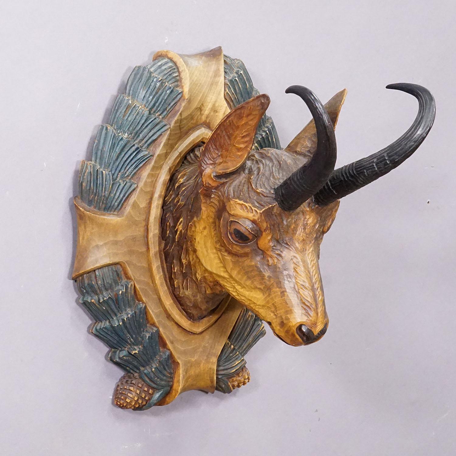 Large Naturalistic Black Forest Carved Chamois Head, ca. 1930s

A large antique wooden carved Black Forest chamois head handcarved in naturalistic style and fitted with real chamois backs. A great individual piece which enhances every cabin wall