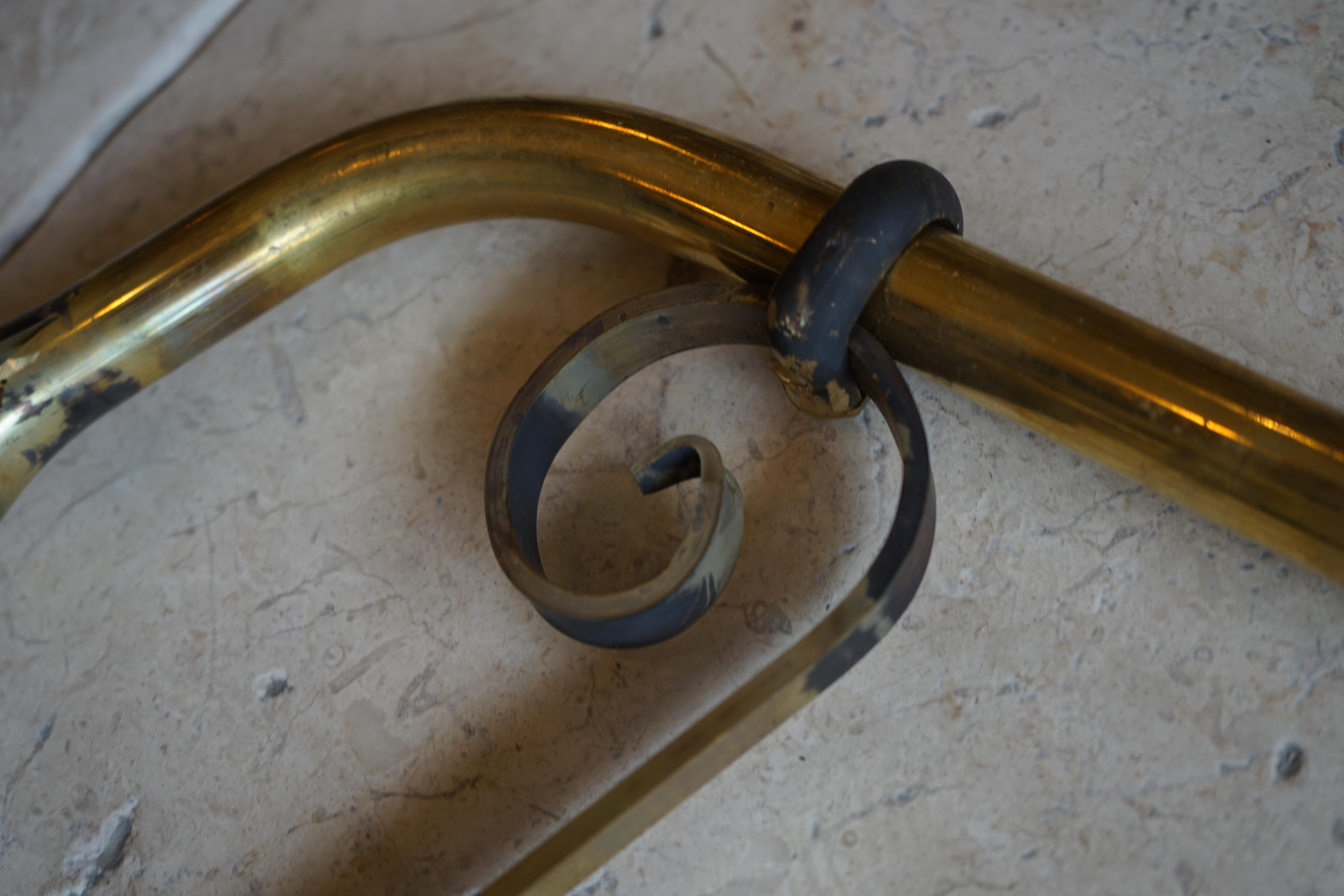 This large naval brass fountain spout features an S-curl design feature. 

Measurements: 16