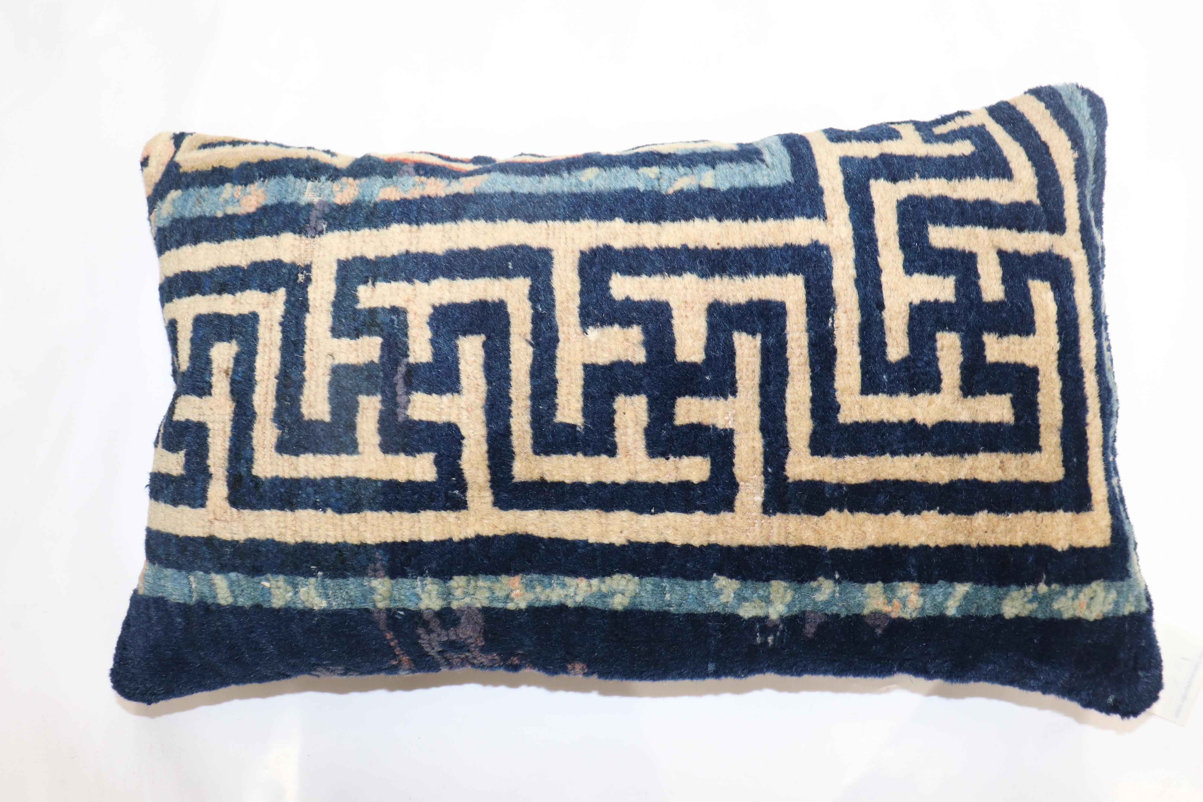 Pillow made from a 20th-century Chinese rug with zipper closure and poly-fill.

Measures: 14'' x 24''.
