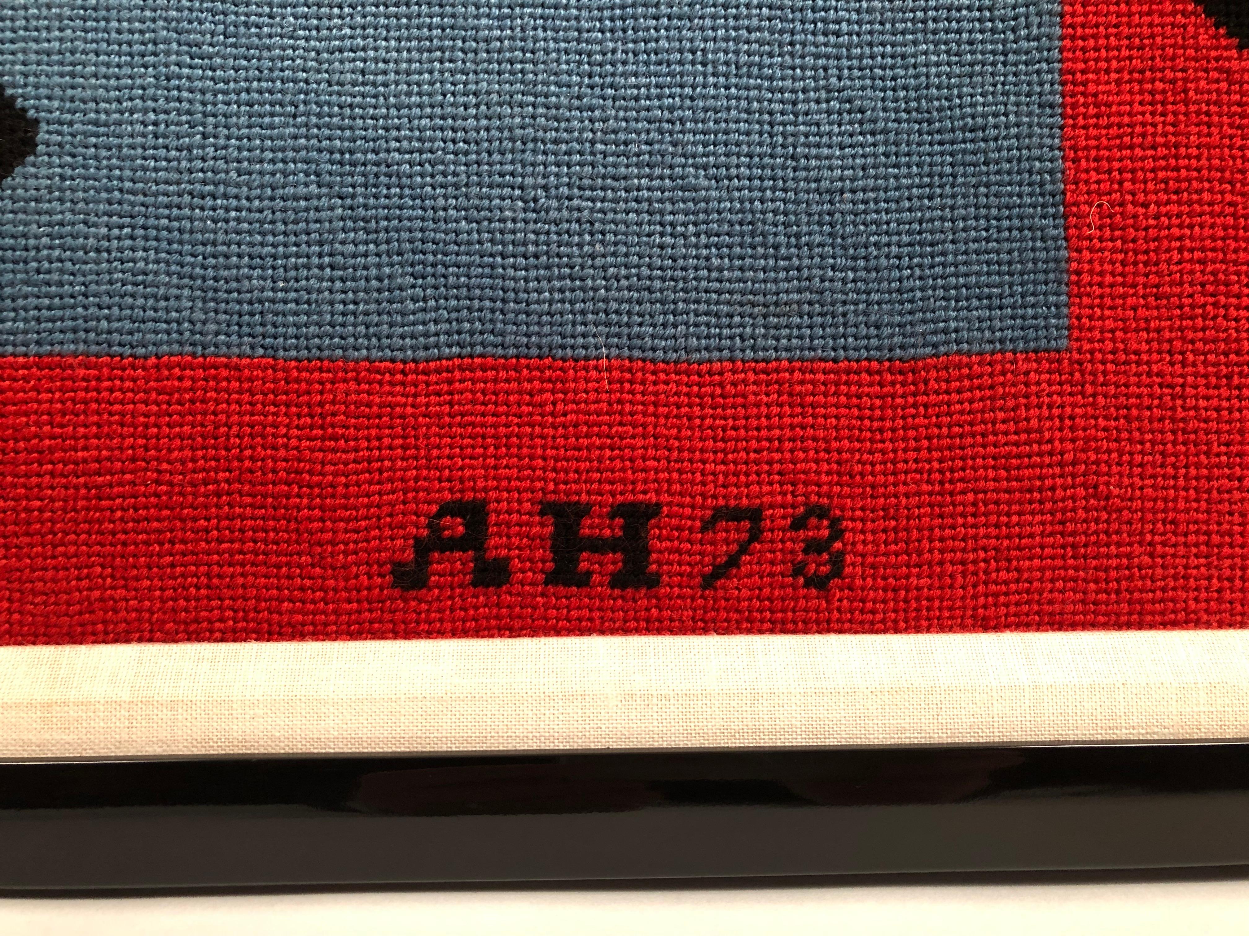 A large vibrant needlepoint picture, handmade in 1973, after Stuart Davis's 1954 abstract painting entitled Colonial Cubism, currently in the collection of The Walker Art Center, Minneapolis. Black, white, yellow and blue geometric shapes are