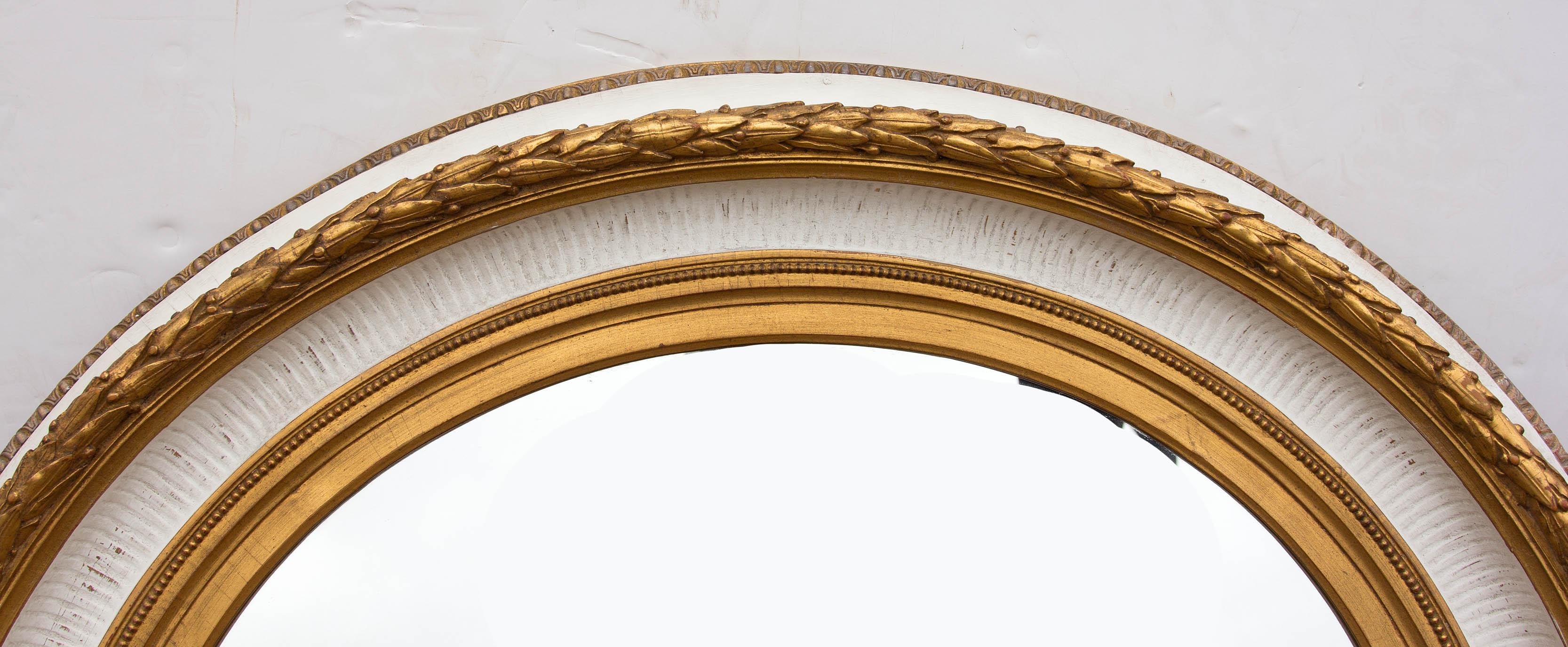 Large 19th century style fluted cove with acanthus border. The mirror is substantial and very high quality. It may be hung horizontal or vertical.