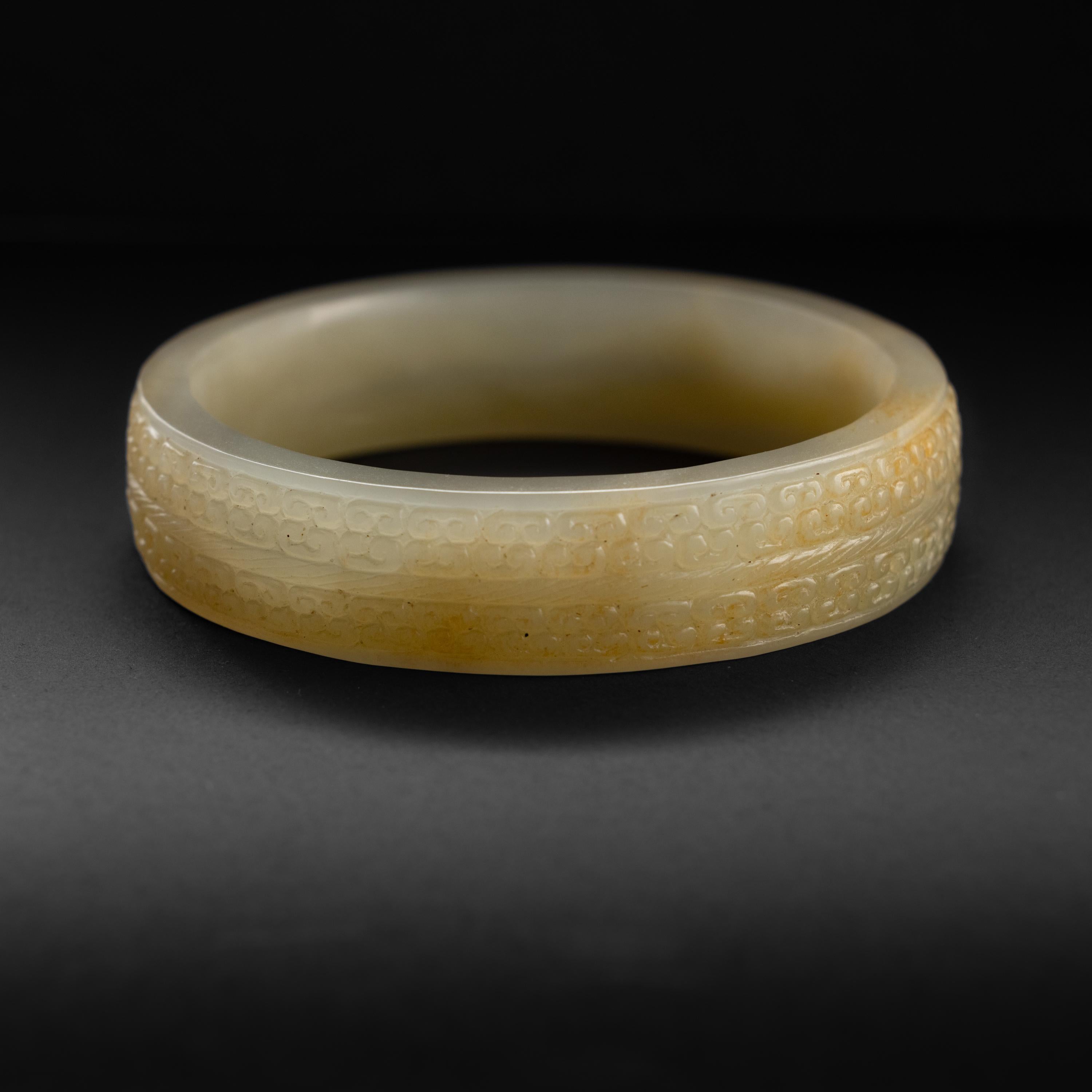 Fine carved jade bangles for men are few and far between. If often takes me over a year to source (or commission) a man-sized bangle and in this case it was well worth the weight. Hand-carved from 100% natural and untreated nephrite jade. This
