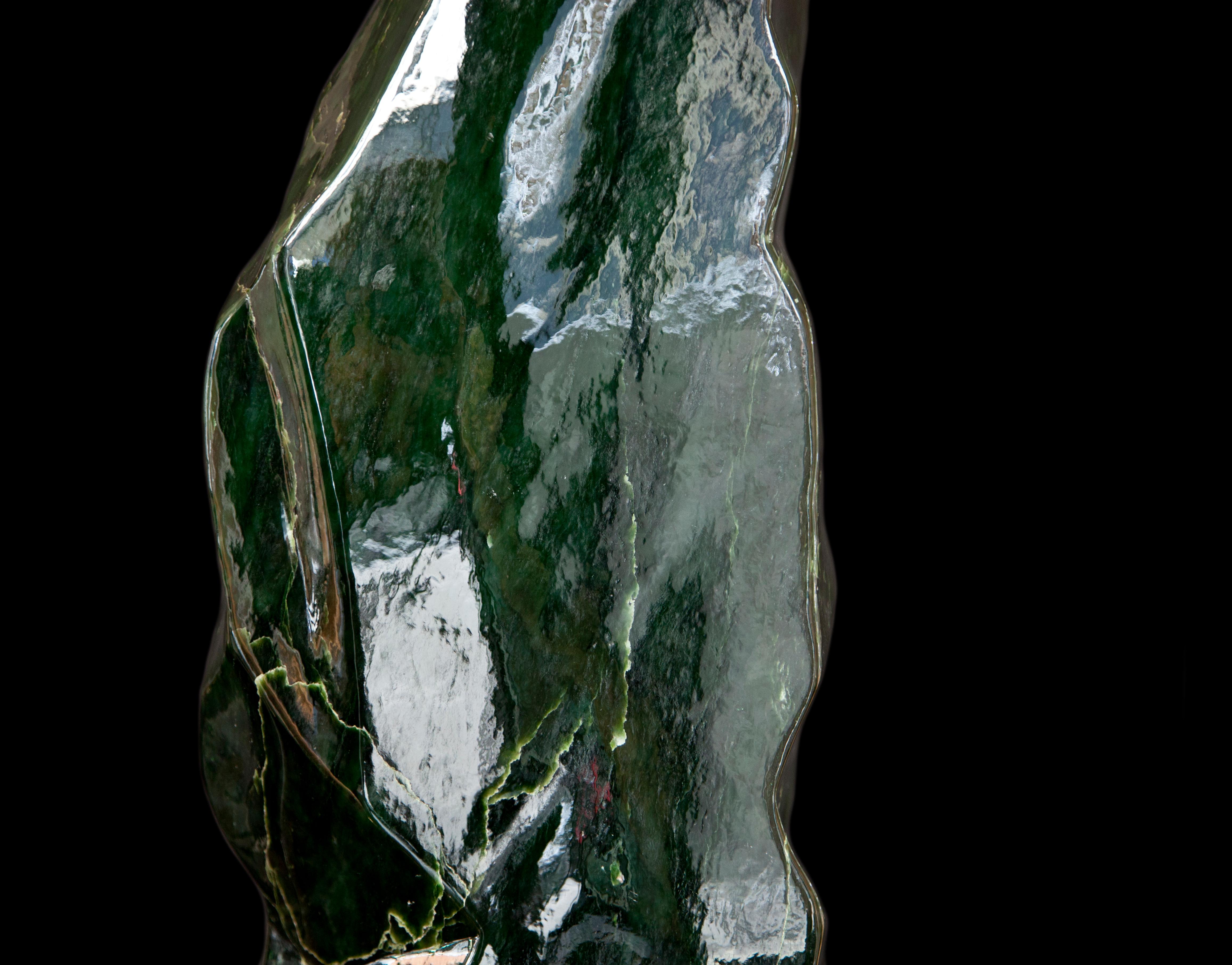 This magnificent piece of Nephrite Jade is currently one of the statement pieces in our showroom. Dark inky-green hues, smooth texture, sculpture-like shape and a colossal 70cm in height make it the perfect showpiece for any interior. It has a