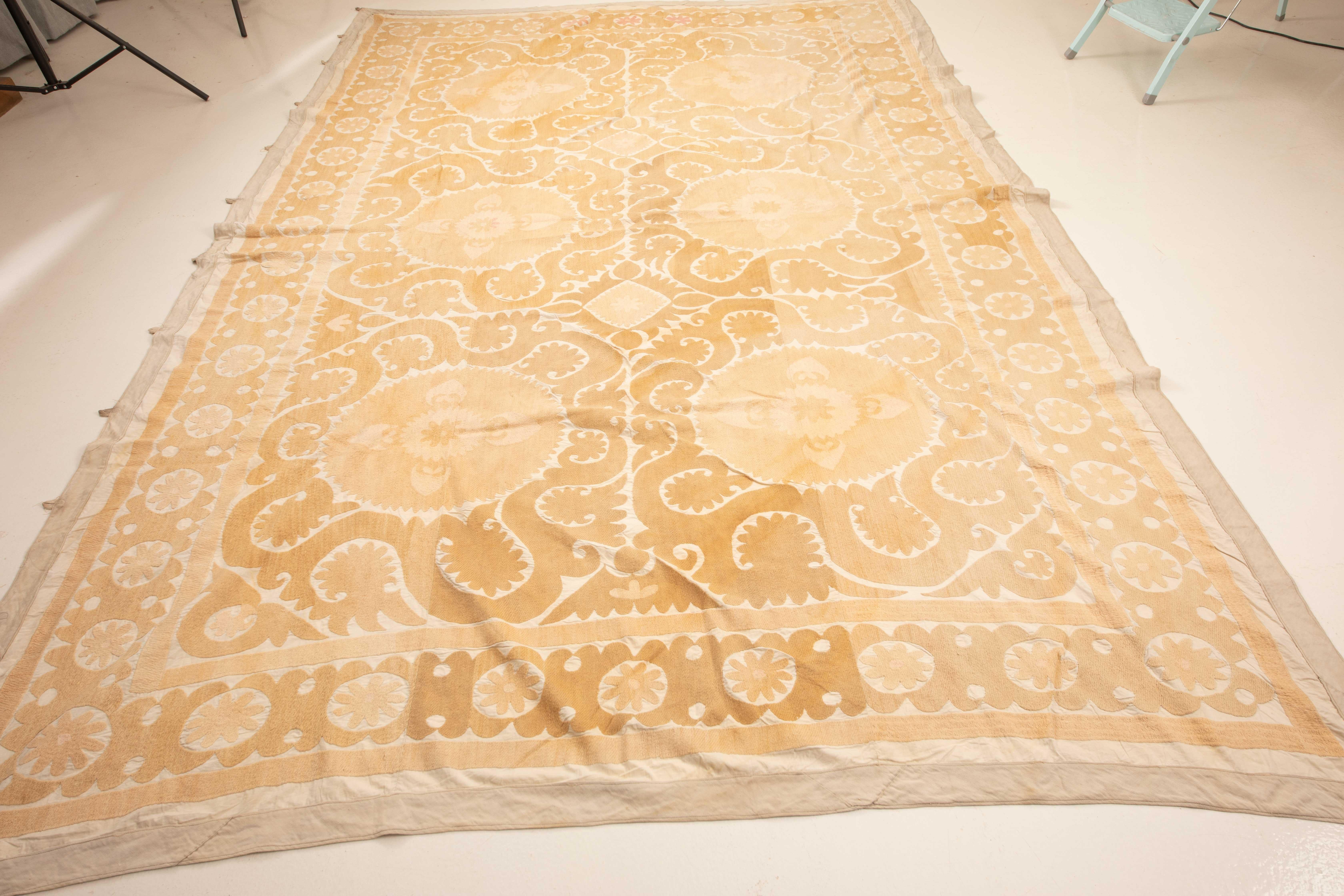 This is a large neutral suzani embroidered in cotton from Samarkand, Uzbekistan from 1960s.
 