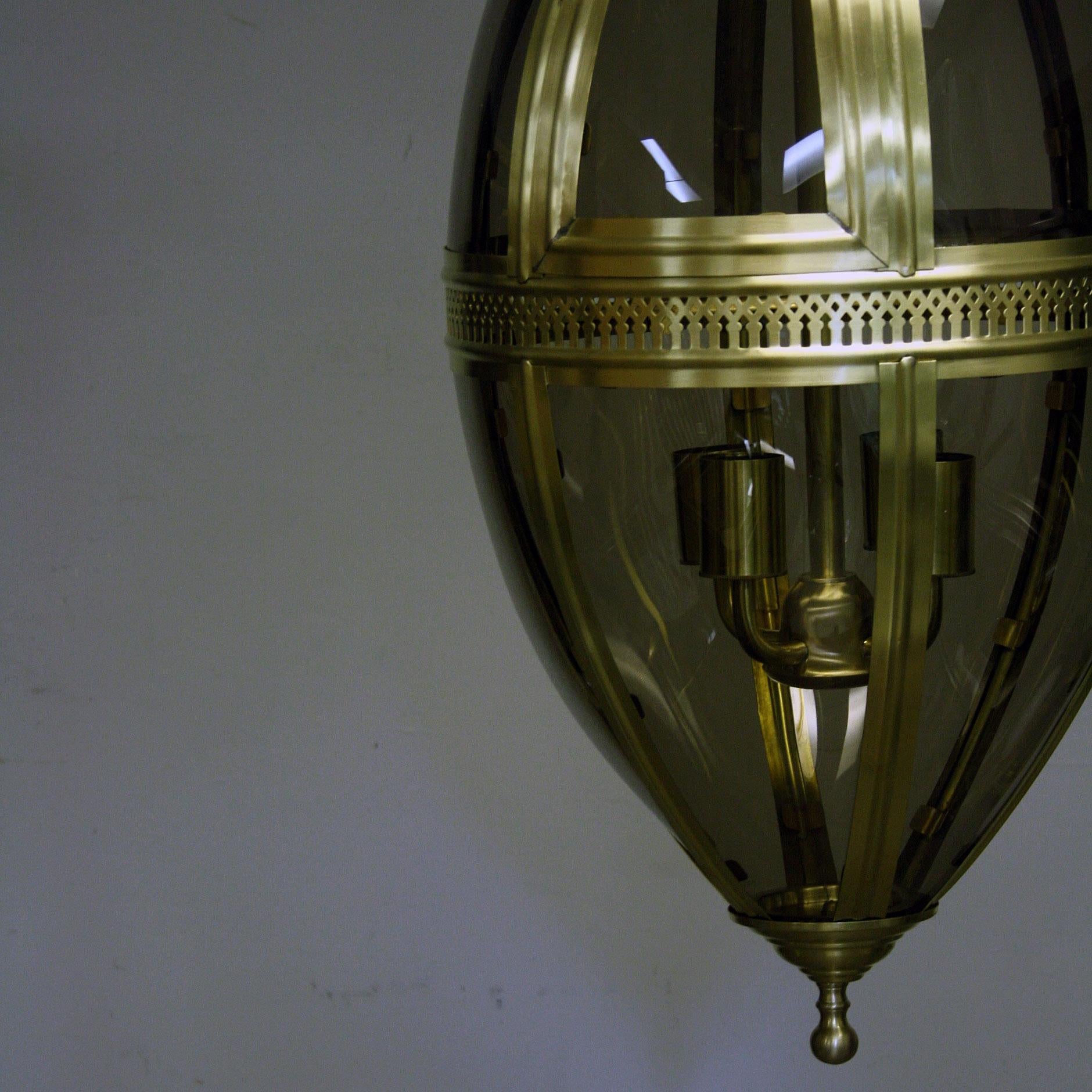 A reproduction oval shaped hanging lantern with curved glass panels, comes in a black and brass coloured finish.

Have 4 of each colour in stock so would work perfectly for a bar or restaurant project or great as a single piece for an interior