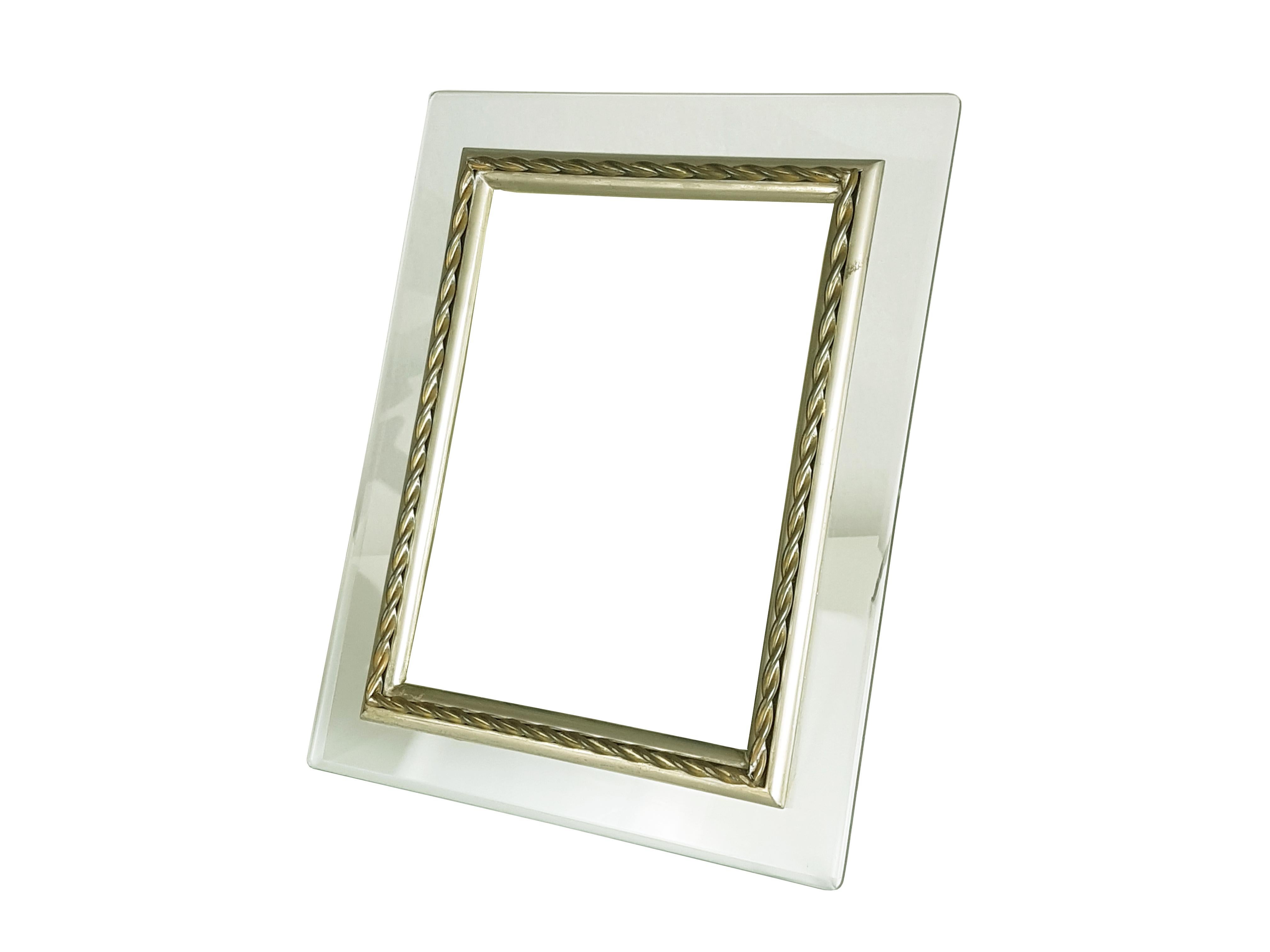 Set of 2 picture frames. They are made in ground glass with and internal decorative nickel-plated & brass frame.
Very good vintage condition: oxidation patina on the metal parts. Light few defect of the glass around some corners.
One corner has