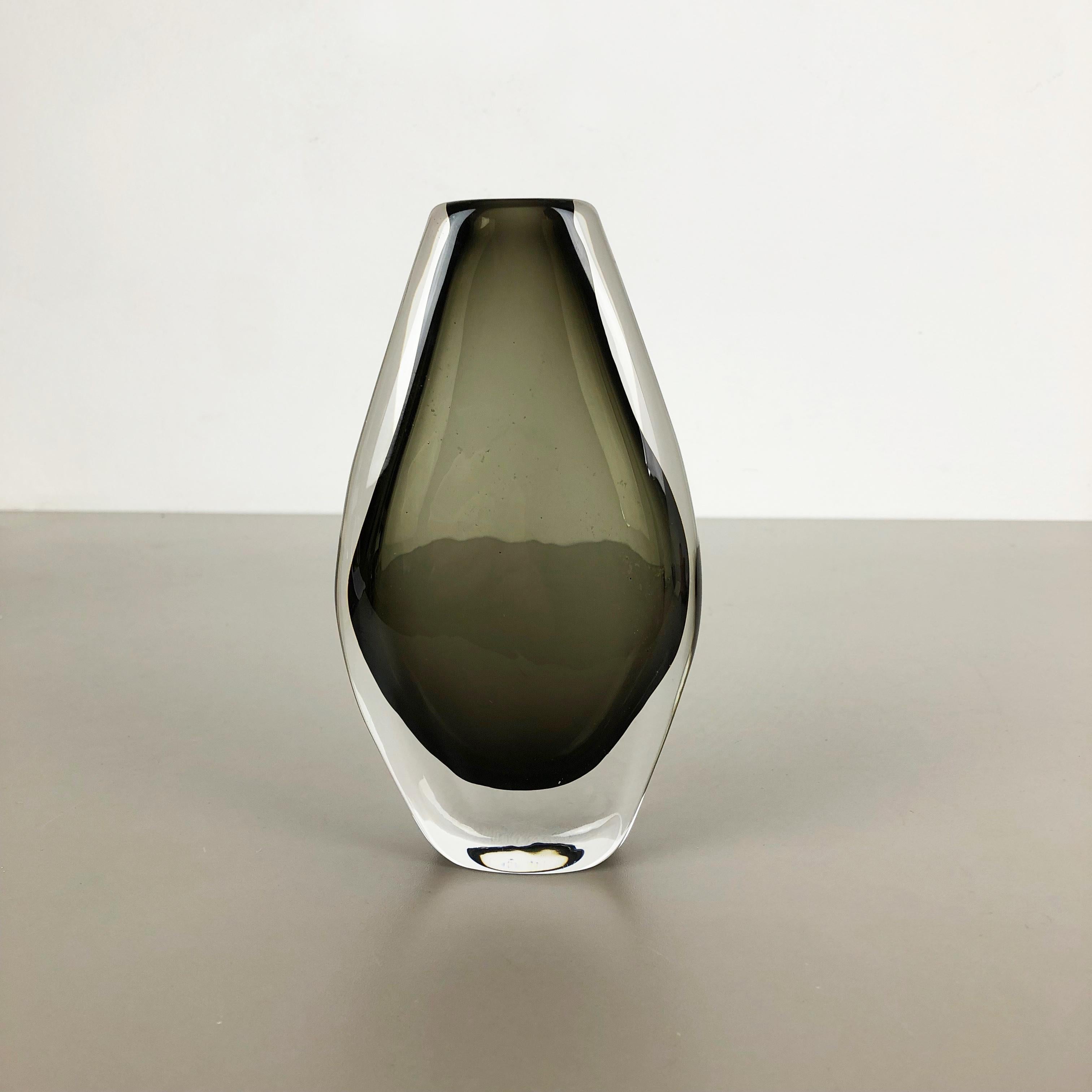 Article:

glass vase


Design:

Nils Landberg

Producer:

 Orrefors, Sweden 1970s

Age:

1970s


Description:

Wonderful heavy glass elements designed by Nils Landberg and produced by Orrefors in Sweden in the 1970s. the element