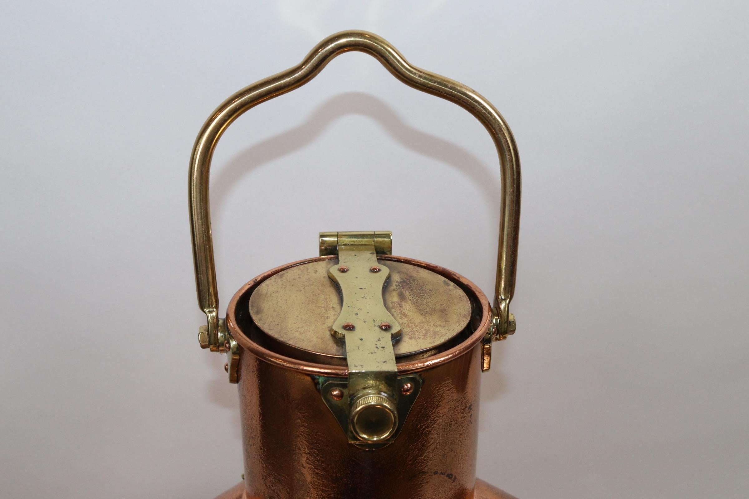 Very heavy authentic ships port side lantern from Tokyo Japan. With polished copper case, sturdy and thick brass trim, flanges, hinges and protective bars. The clear glass fresnel lens is backed with a sliding red filter. The lantern is topped with