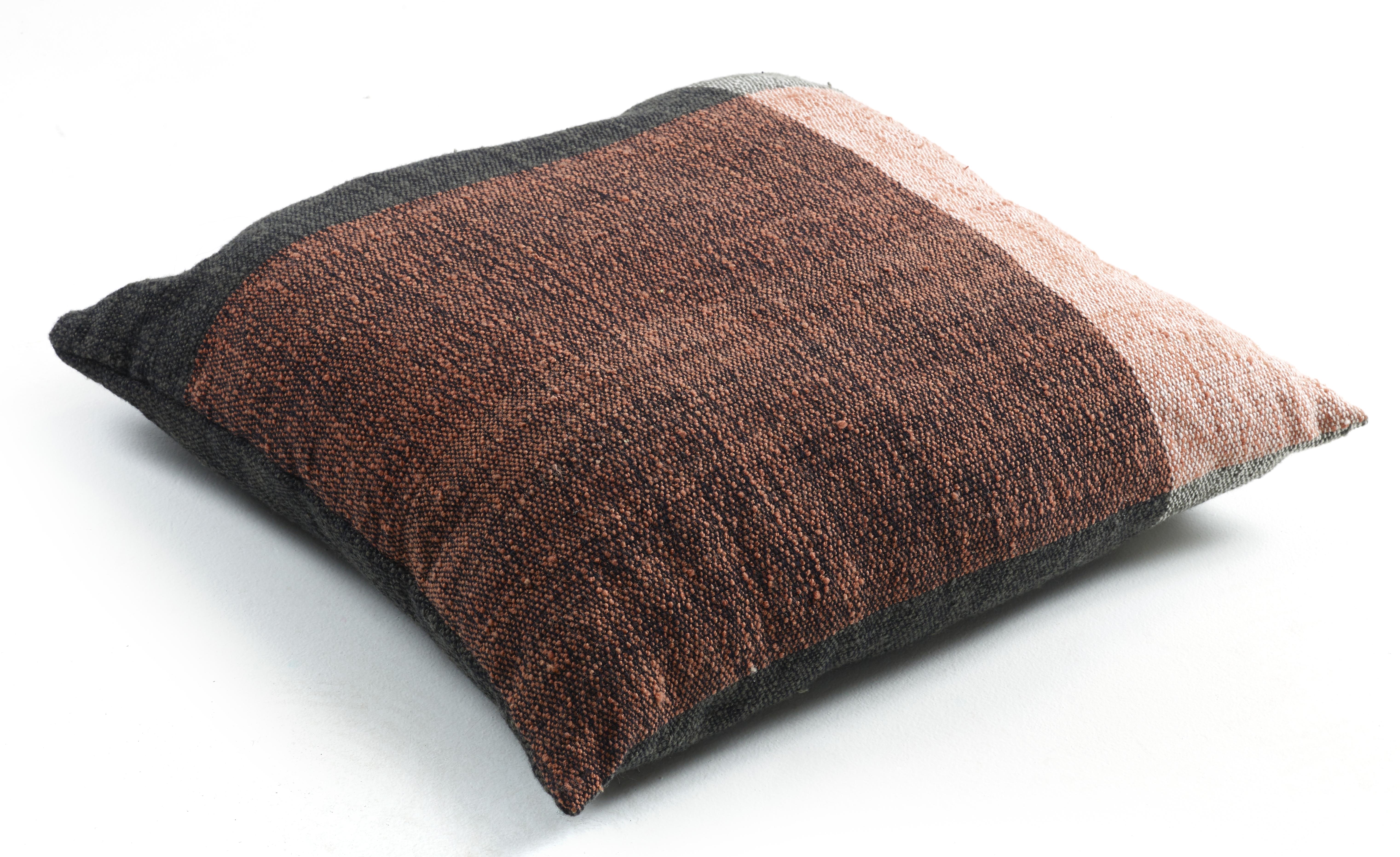 Large Nobsa cushion by Sebastian Herkner
Materials: 100% natural virgin wool. 
Technique: Hand-woven in Colombia. 
Dimensions: W 80 x H 80 cm 
Available in colors: grey/ grey/ cream, grey/ ochre/ cream, red/ ochre/ cream, blue/ mint/ cream, rose/