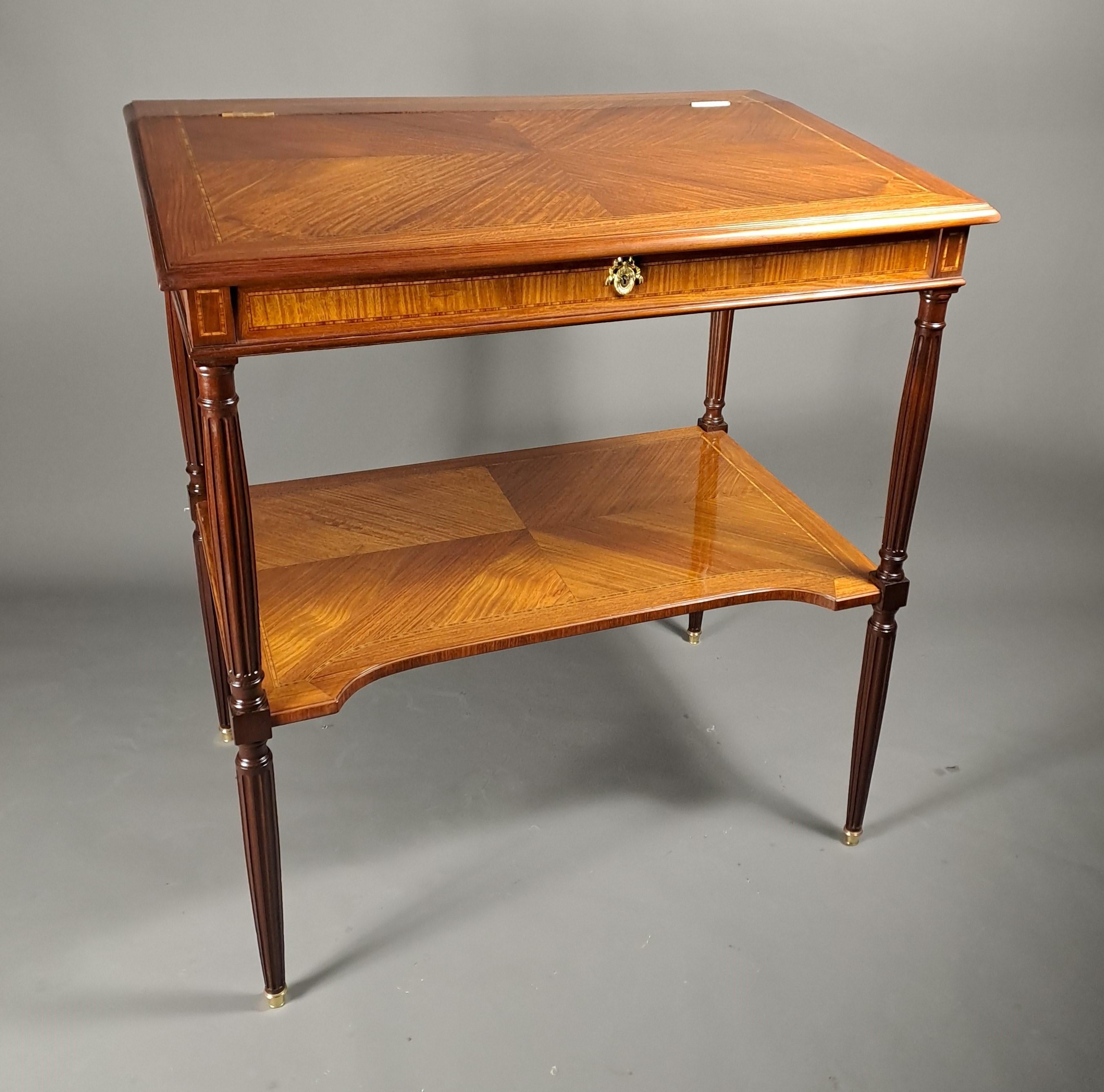 Rare Louis XVI style notary writing desk made of mahogany frieze marquetry and light wood and rosewood fillet friezes.

Four solid mahogany fluted legs joined by a spacer shelf.

French work of very good quality. Ideal piece of furniture for a