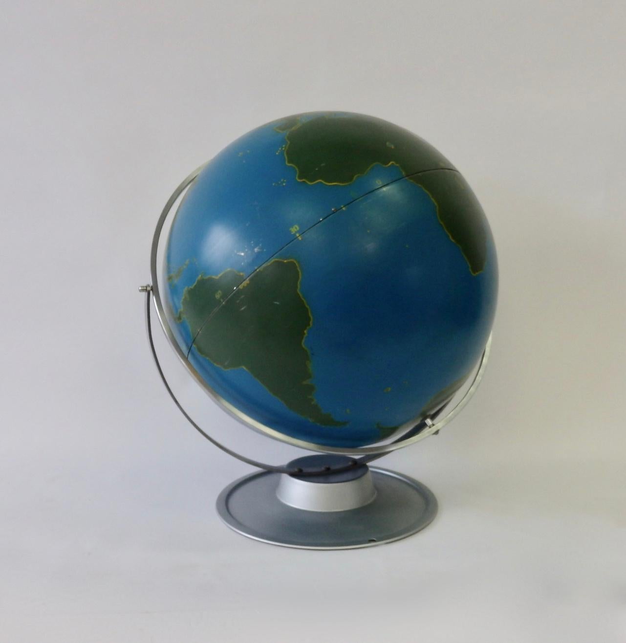 Large lacquer over aluminum rotating and swivel schoolhouse globe on brushed chrome with lacquer base stand.