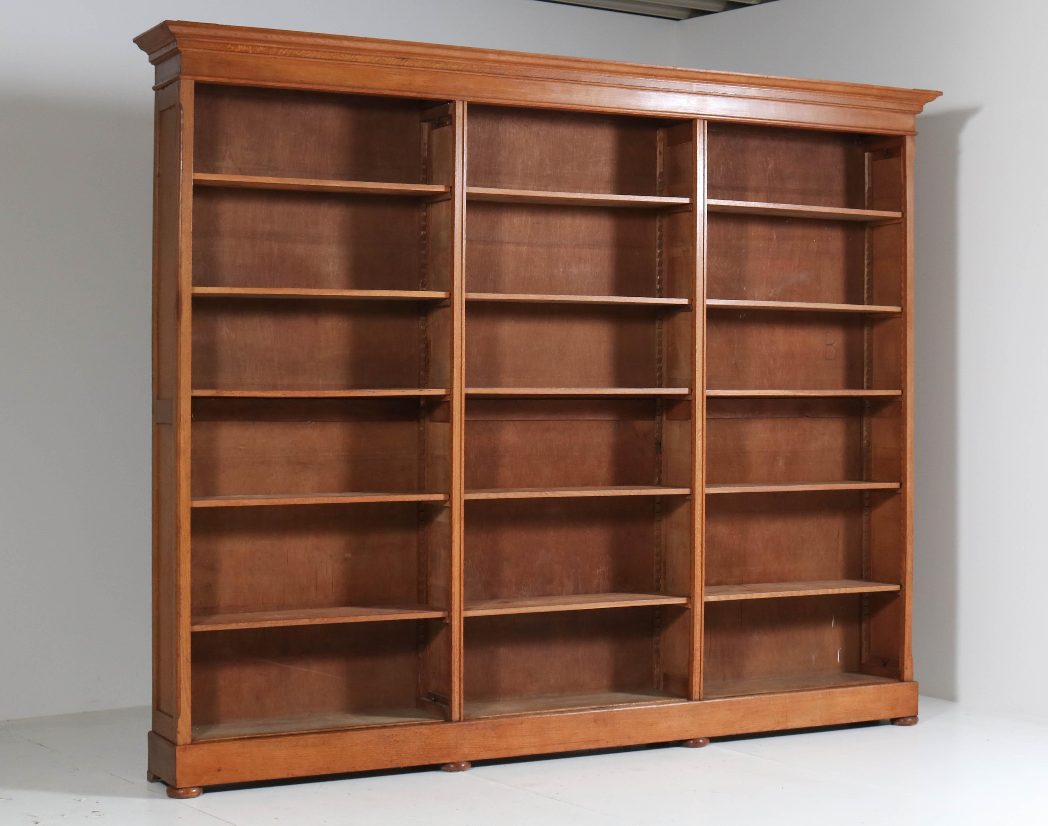 Wonderful and rare extra large library open bookcase.
Rare because of its size, 315 cm or 124.02 in wide!
Measures: Height 252 cm or 99.21 in., depth 38 cm or 14.96 in.
Solid oak with fifteen original wooden shelves, adjustable in height.
This
