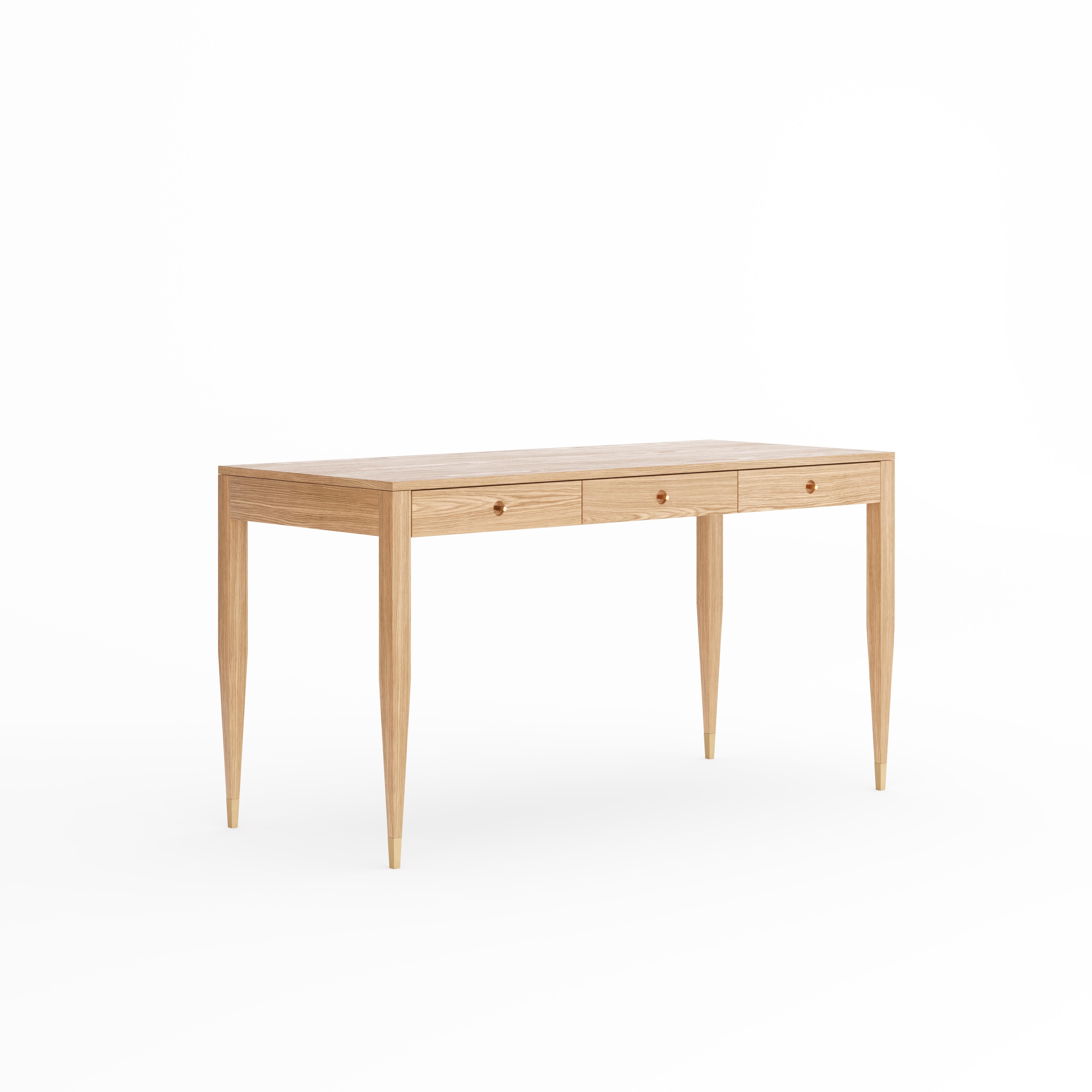 Large oak desk in mid-century style with three drawers and brass handles. The tapered legs are finished with brass plated aluminum feet. Desk made of solid oak wood and wood covered with natural oak veneer. Other wood on request. Perfect as office