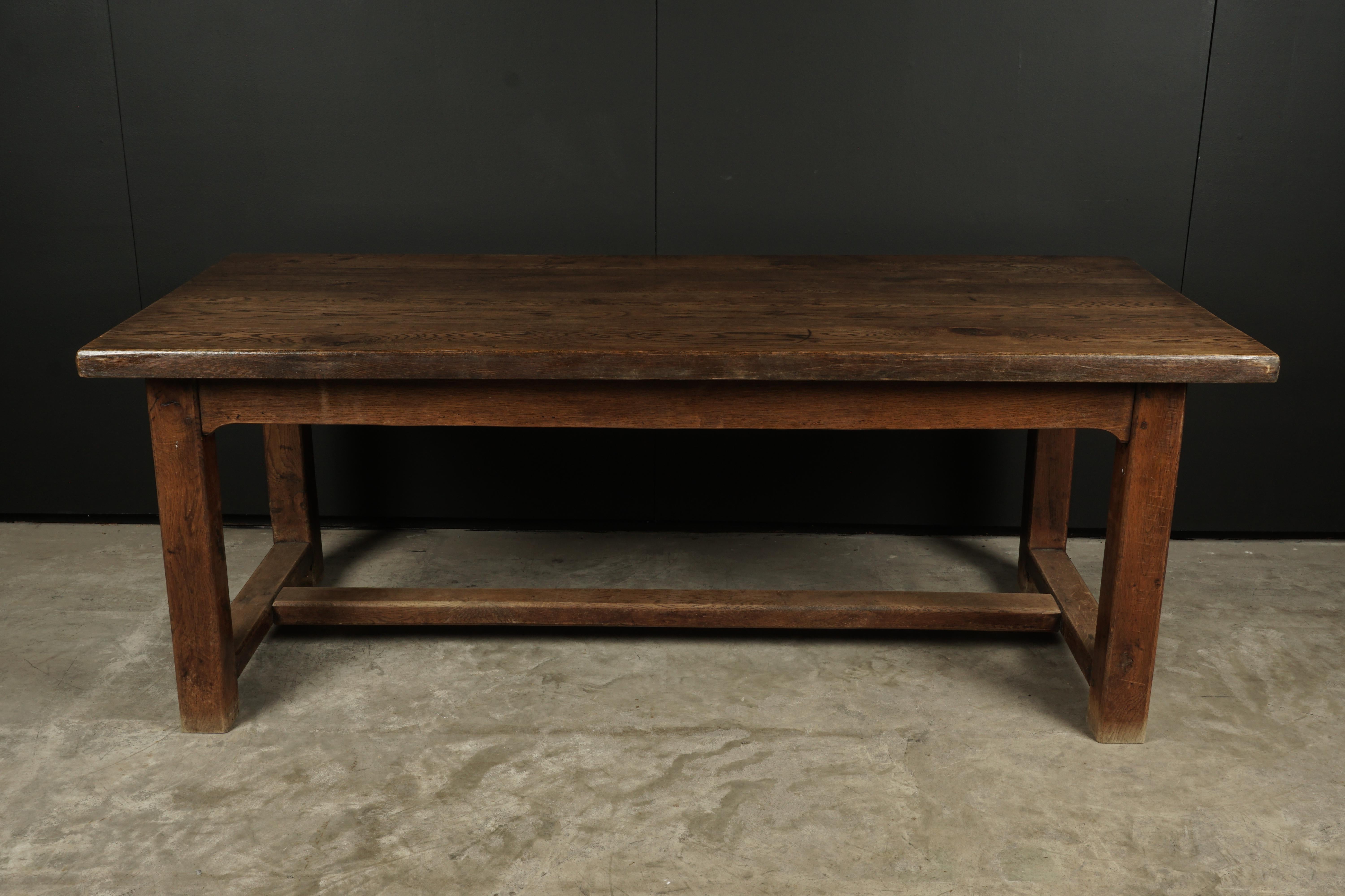 Vintage Large solid oak dining table from France, circa 1940. Solid oak construction with nice wear and patina.