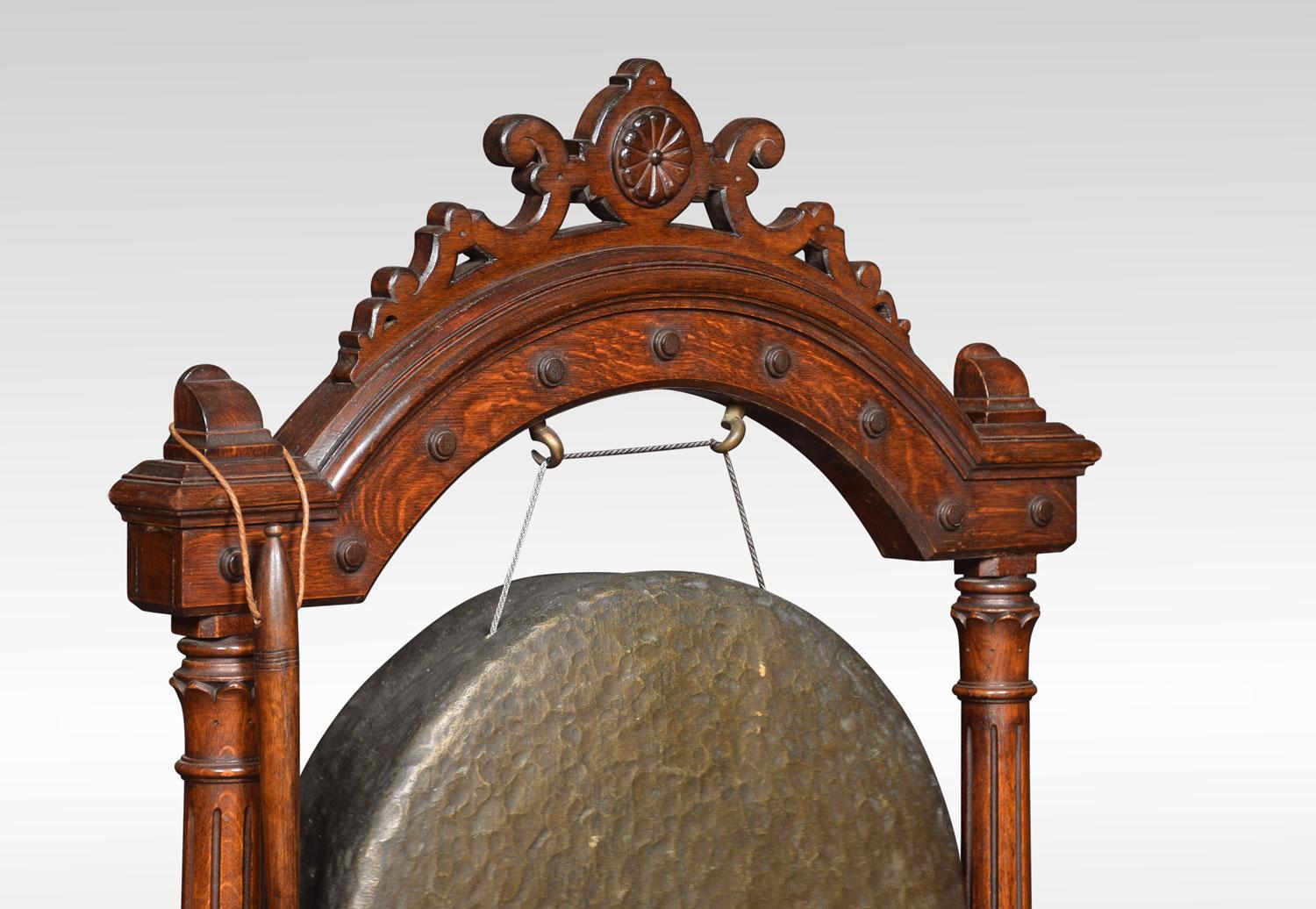 A large Victorian gong mounted in Gothic oak frame with reeded pillar supports, and splayed feet, with original striker.
Dimensions:
Height 46 inches
Width 32.5 inches
Depth 12 inches.