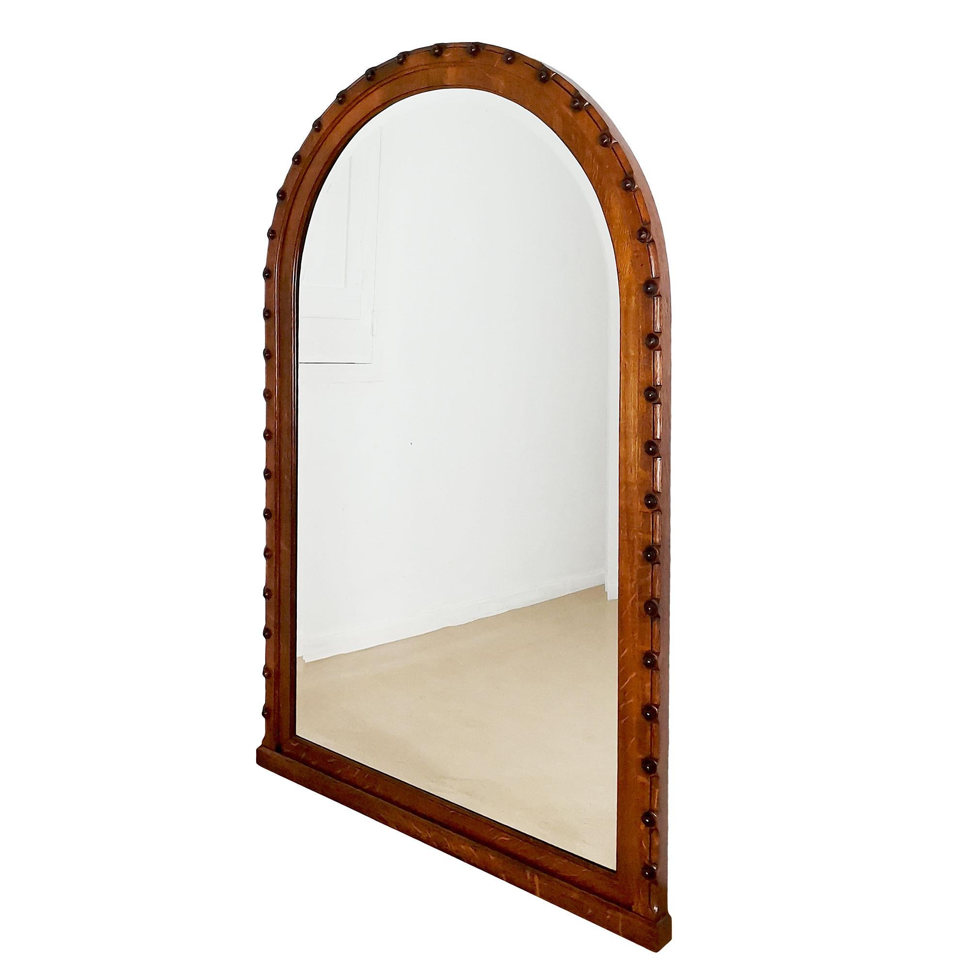 Large oak mirror, oak veneer with round decoration, very thick original bevelled glass. Satin shellac finish.

Spain, Barcelona c.1940.