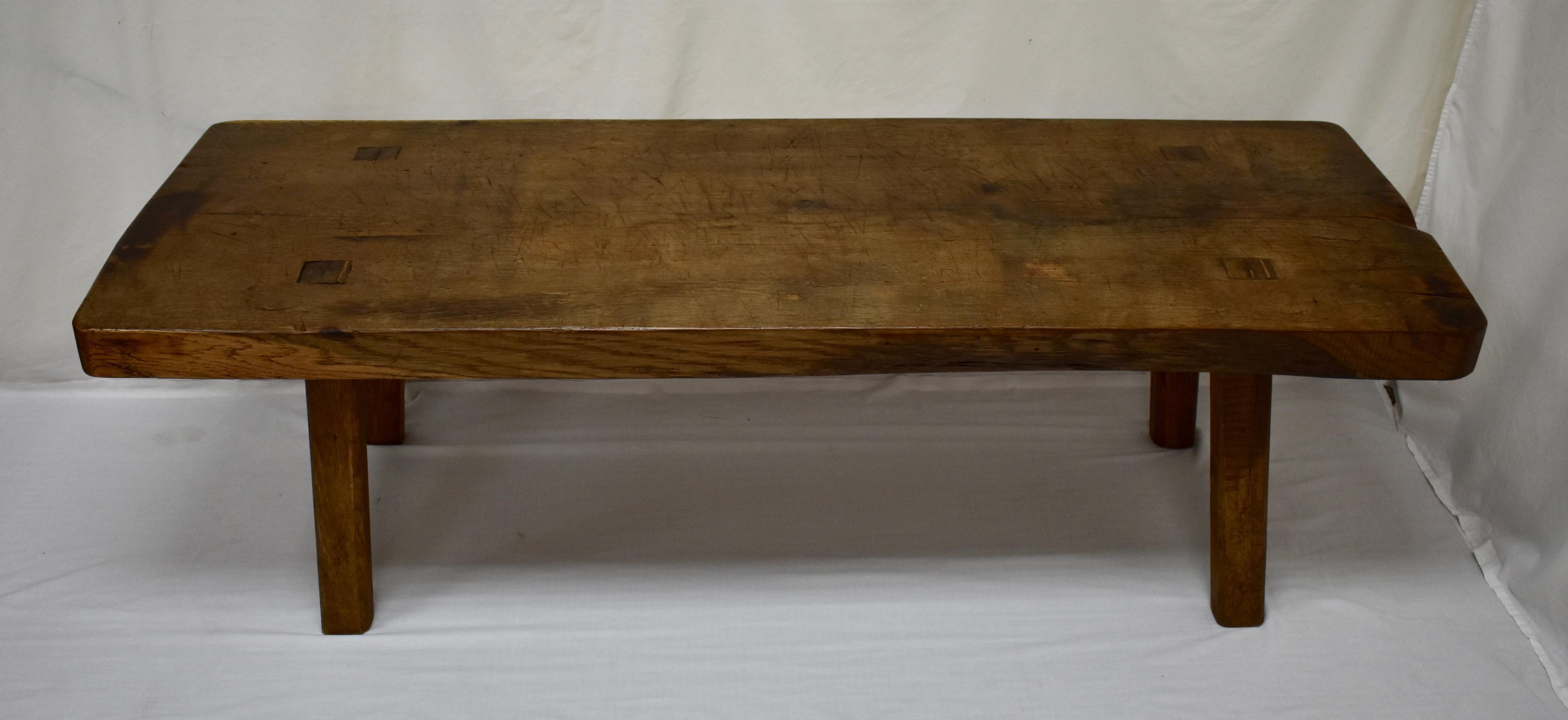 This is the nicest one of these we’ve had for a while. A truly outstanding oak pig bench low table standing on four sturdy hand-hewn splayed legs which are through-tenoned and wedged into the underside of the top. The top itself is a single oak