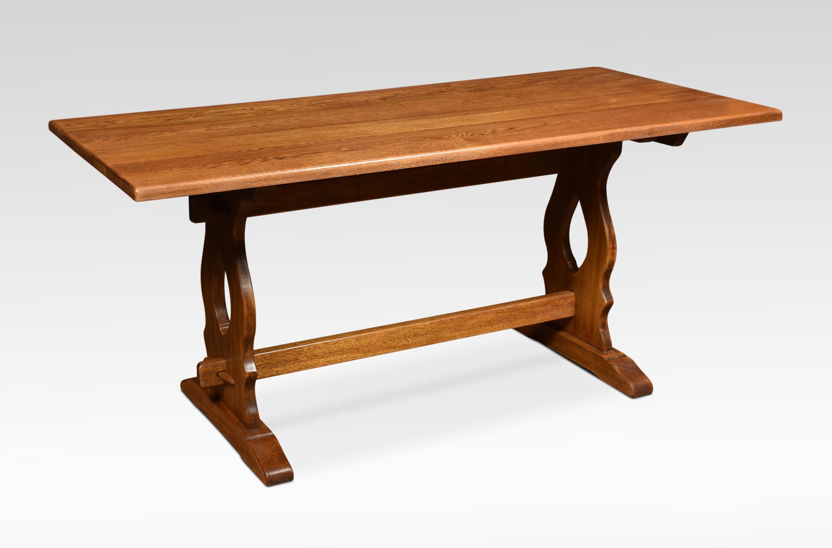Large oak refectory table, the plank top, raised on trestle ends united by stretcher.
Dimensions:
Height 30 inches
Width 66 inches
Depth 30 inches.