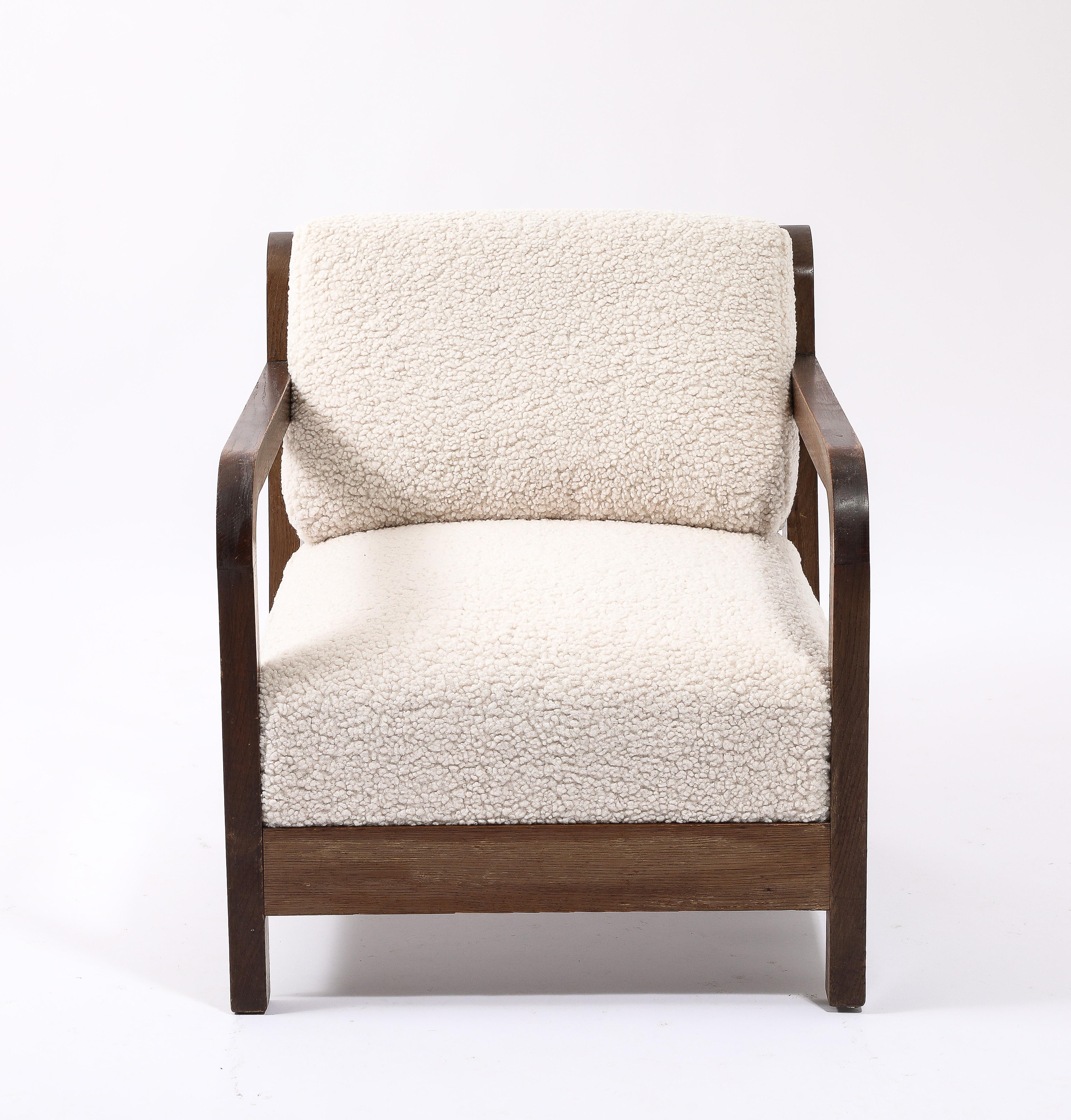 Large Oak Armchairs in the manner of Gabriel with a ladder back construction. Reupholstered in faux shearling.

