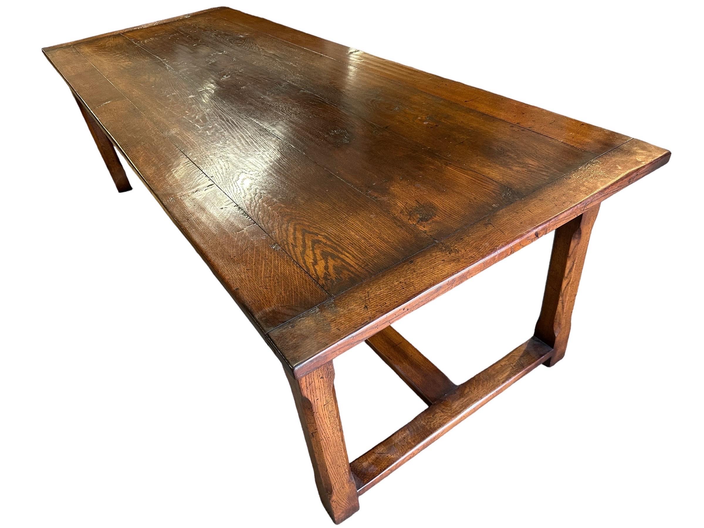 Introducing our spacious and versatile large refectory dining table, designed to accommodate your gatherings with ease. This table features two side extension leaves, allowing you to expand the seating capacity as needed. The table rests on a sturdy