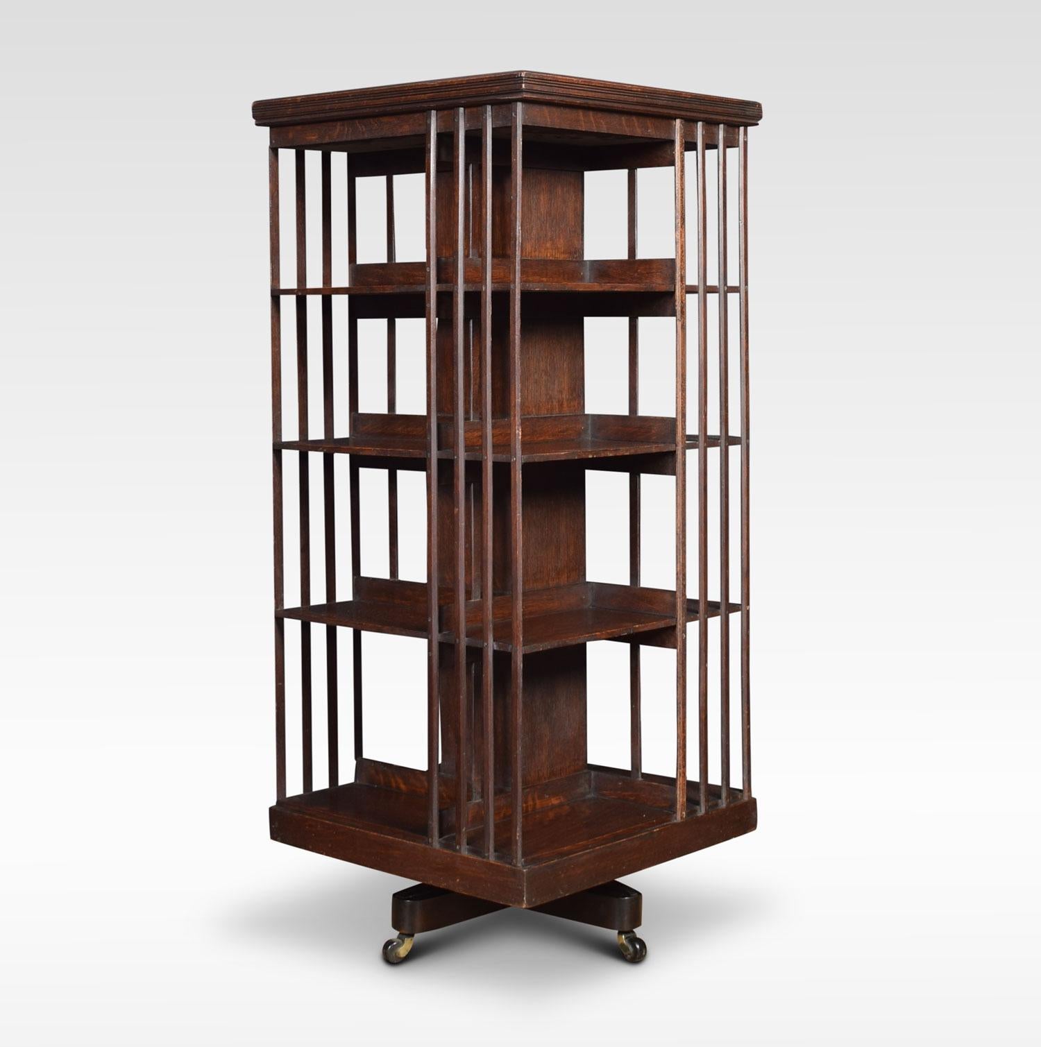 Tall oak revolving bookcase the square moulded top above four tiers with an arrangement of shelves. Raised up on metal cruciform base terminating in ceramic castors.
Dimensions
Height 54.5 Inches
Width 24 Inches
Depth 24 Inches