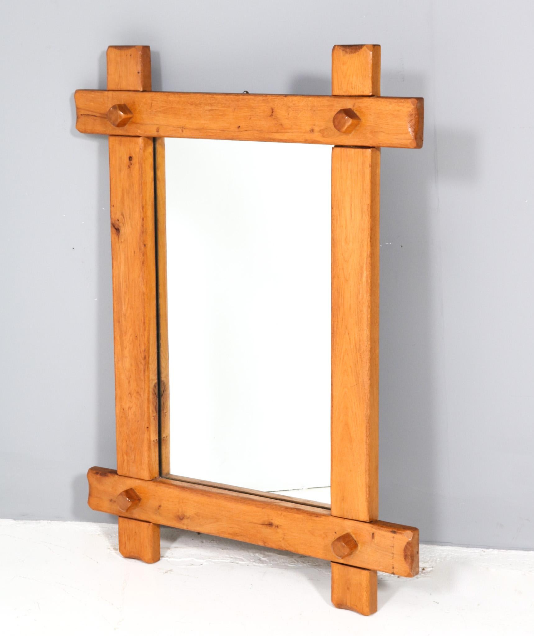 Stunning and rare  large Rustic Brutalist wall mirror.
Striking Dutch design from the 1970s.
Solid oak frame with original mirrored glass.
A real eye-catcher in your home or office.
This wonderful Rustic Brutalist wall mirror is in very good