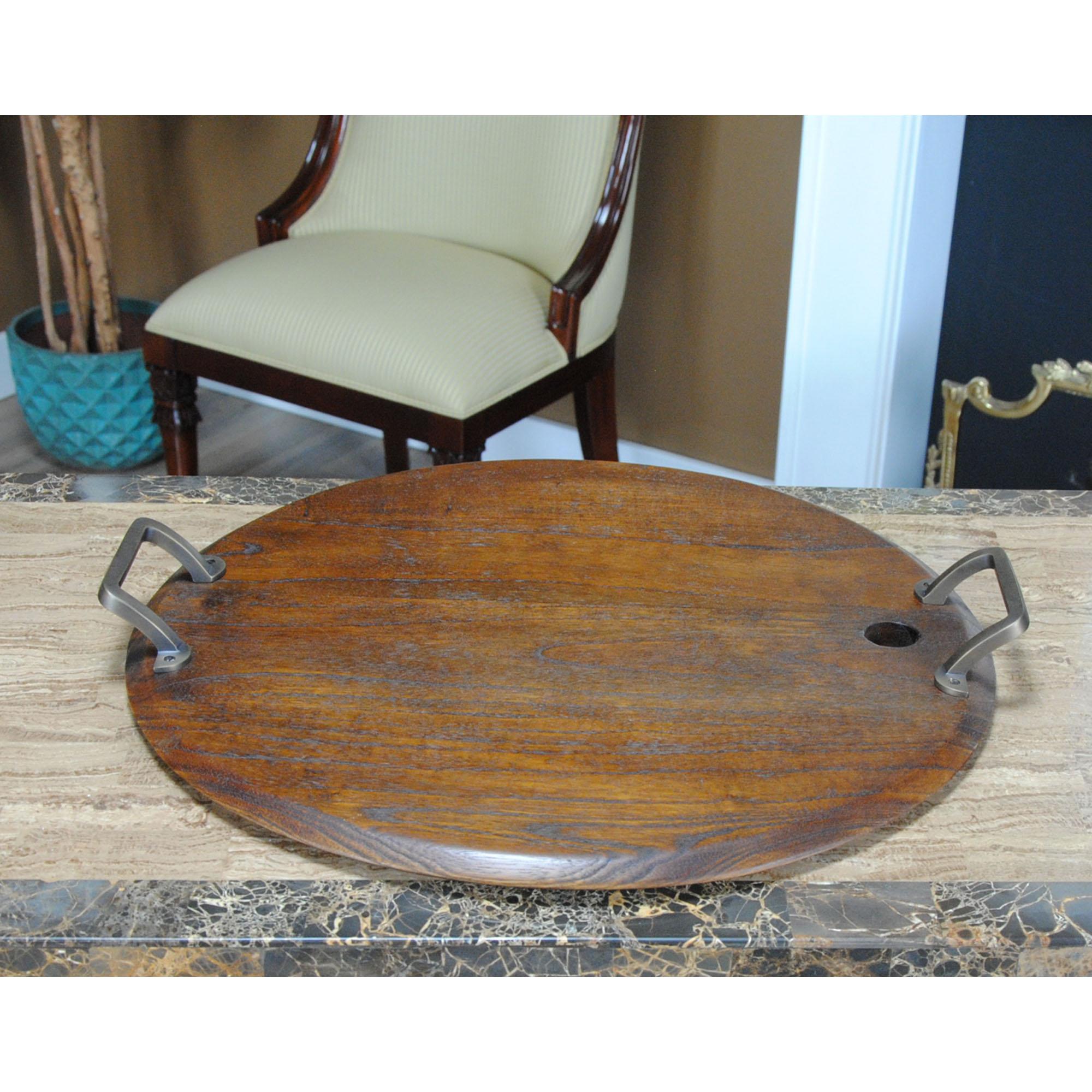 From Niagara Furniture, this Large Oak Wine Barrel Tray is produced from solid oak and created to resemble the end of a wine barrel.  Using a wooden cutting / serving board provides a very resilient surface while protecting knives from damage.  This