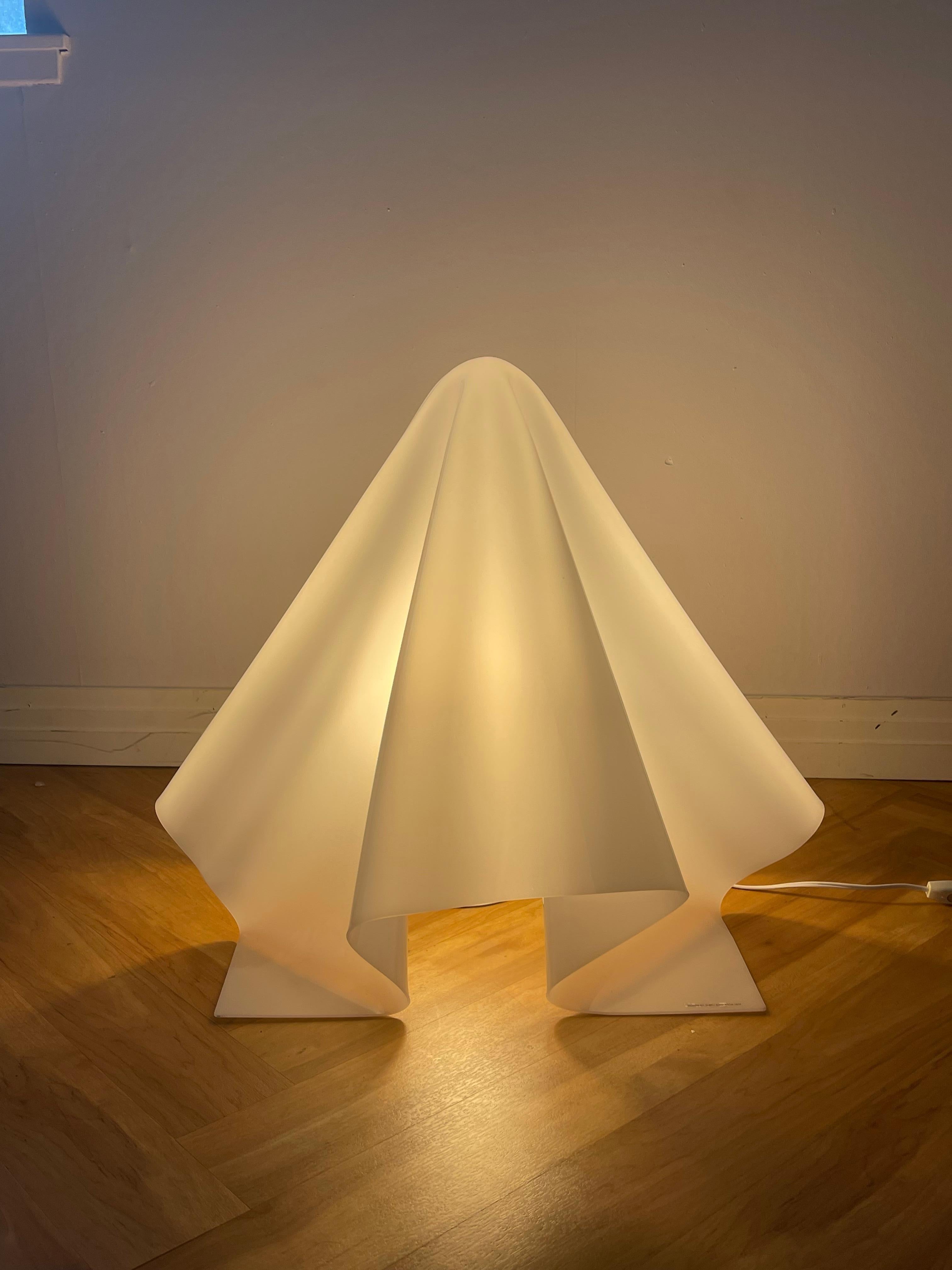 Large Oba-Q K series floor lamp by Shiro Kuramata. White acrylic shade with external light source. Excellent condition. Kuramata, one of the most influential post-modern designers, is one of Japan’s most sought after for collectors.