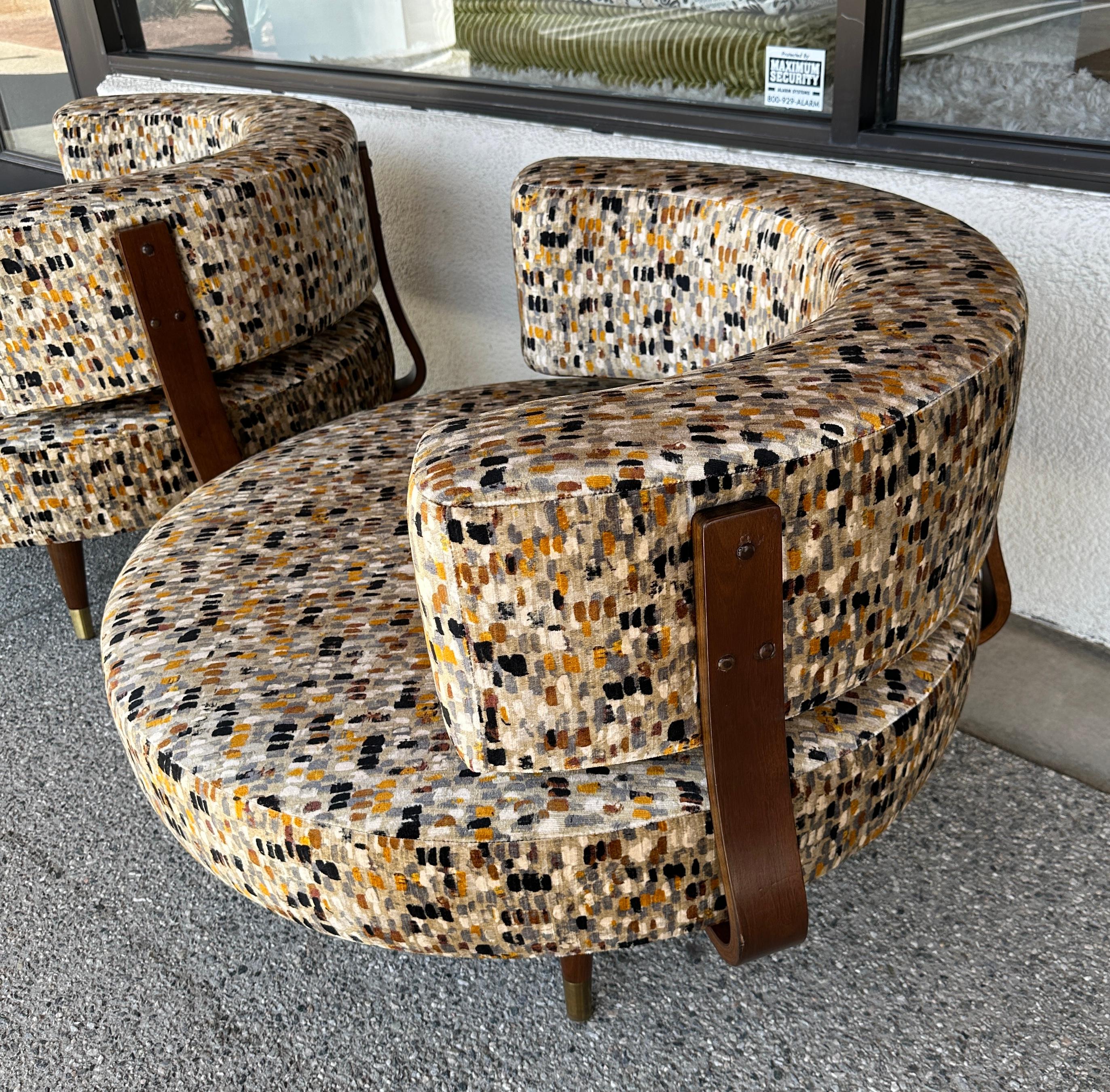 A fabulous pair of Adrian Pearsall large oversized round swivel chairs redone in a beautiful printed cotton velvet fabric by Romo called Murano Anise. It s a cotton/viscose blend. The chairs swivel completely. There is a back cushion for each in the
