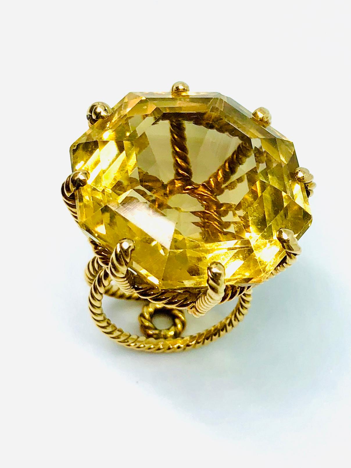 Very large citrine (approximately 50 carats) held in a 18ct yellow gold with a stylish rope twist design. The citrine has a small chip but this doesn’t detract from the overall look. Circa 1965. Ring Size S or US 9.5.

This bold ring may be worn