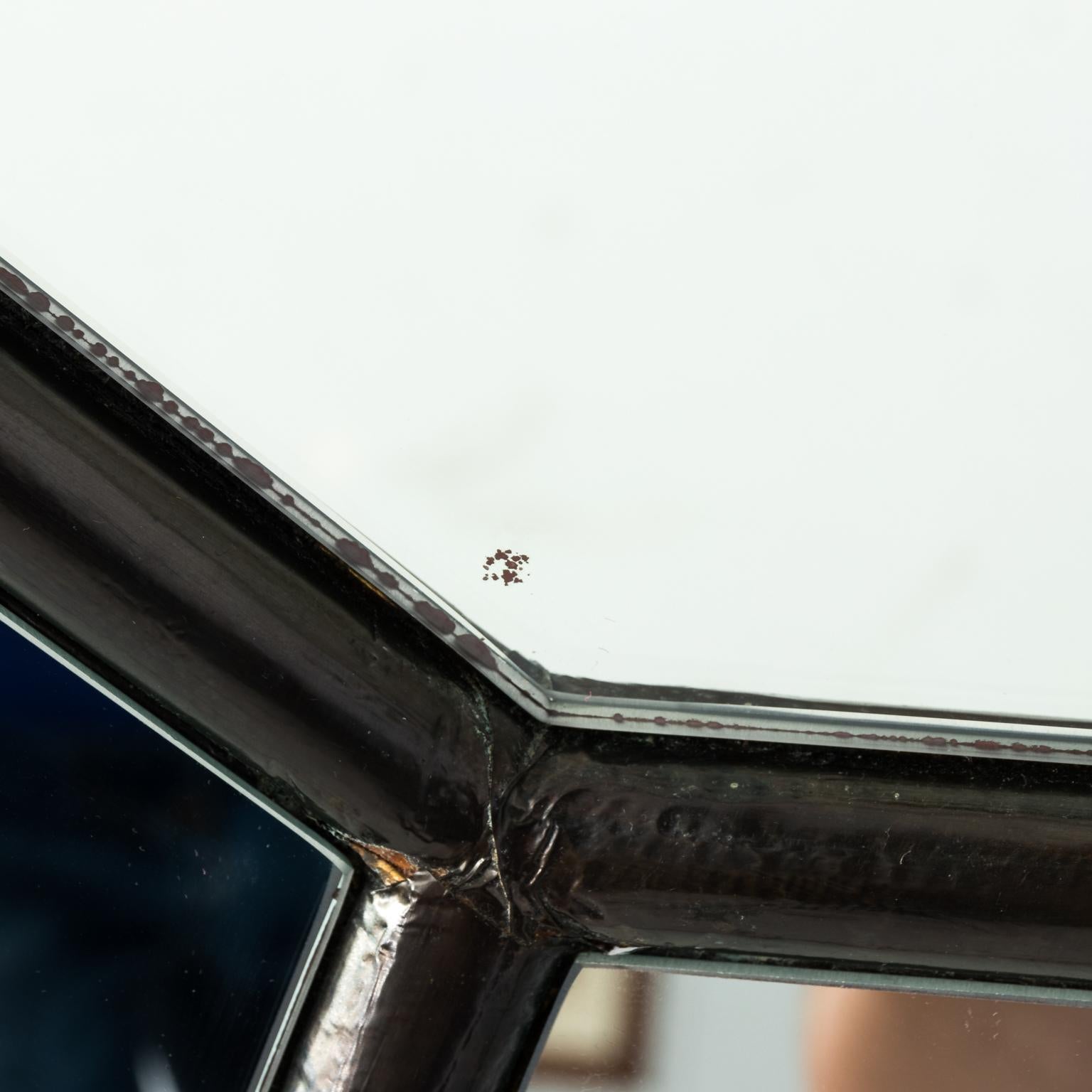 Large concave octagonal mirror. Please note of minor wear and paint loss to the corners of the mirror, circa late 20th century.