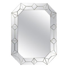 Large octagonal mirror with raised faceted Mirror Surround