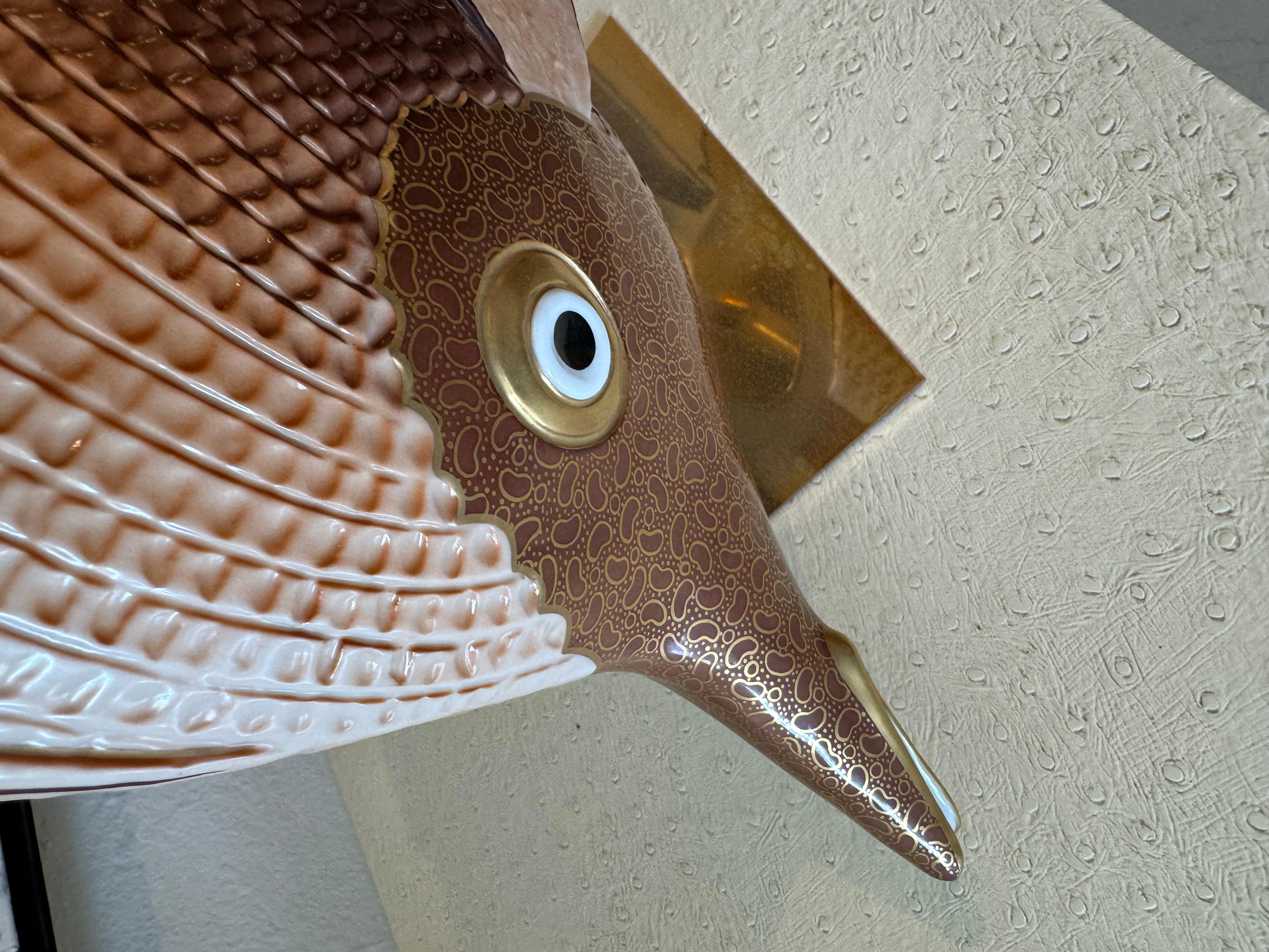 Large fish by oggetti . The brass base has oxidation and a natural patina. The fish is in perfect condition. 