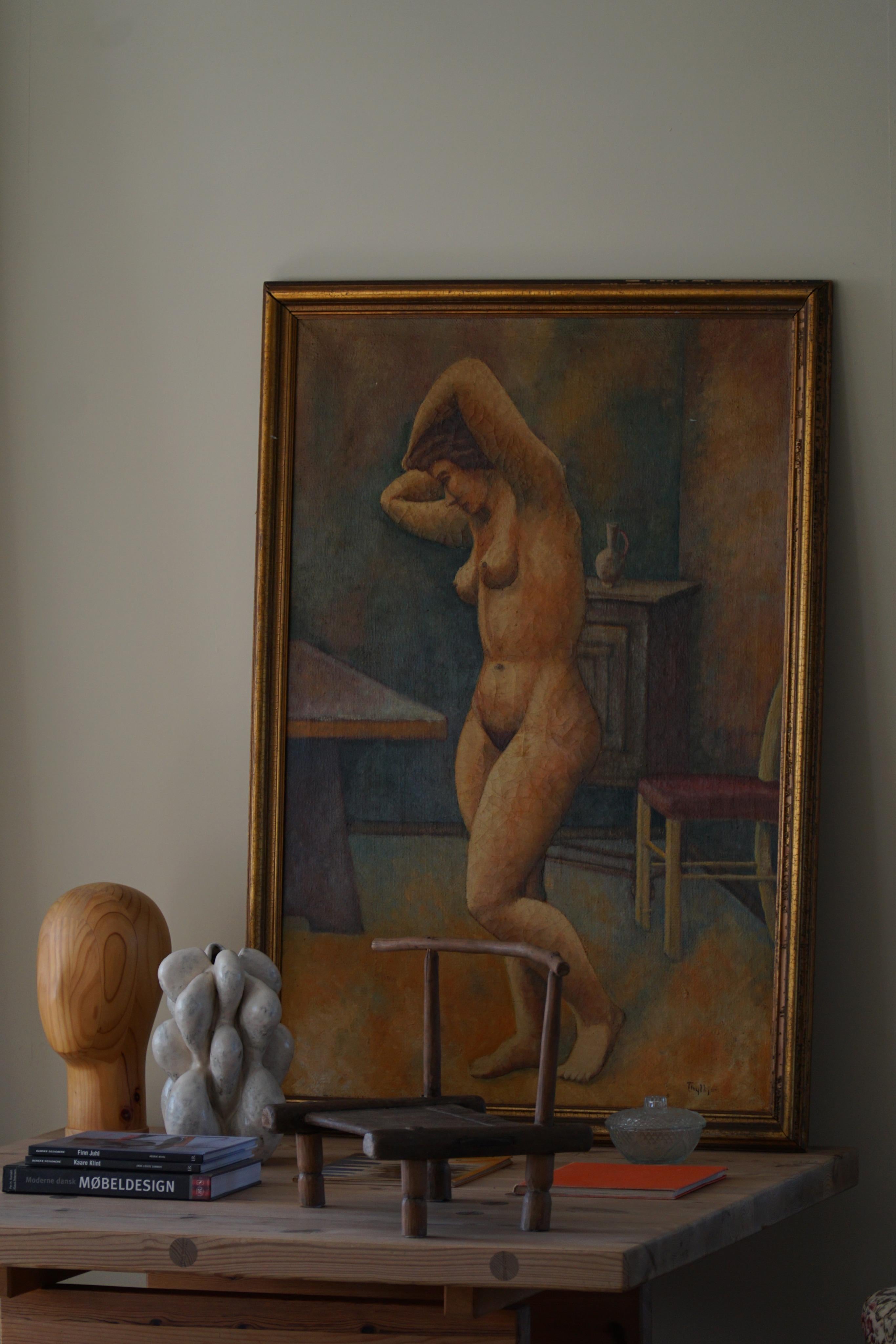 This oil on canvas painting by an unknown Danish artist, made in the late 19th century, is a striking and evocative work of art. The painting depicts a naked woman posing.
The use of light and shadow creates a sense of depth and dimensionality, with