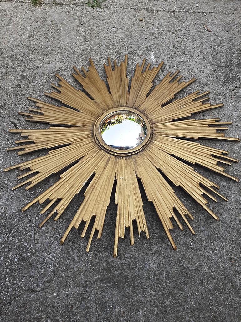 Large old Louis XIV style giltwood sun burst with convex mirror, circa 1900-1930.