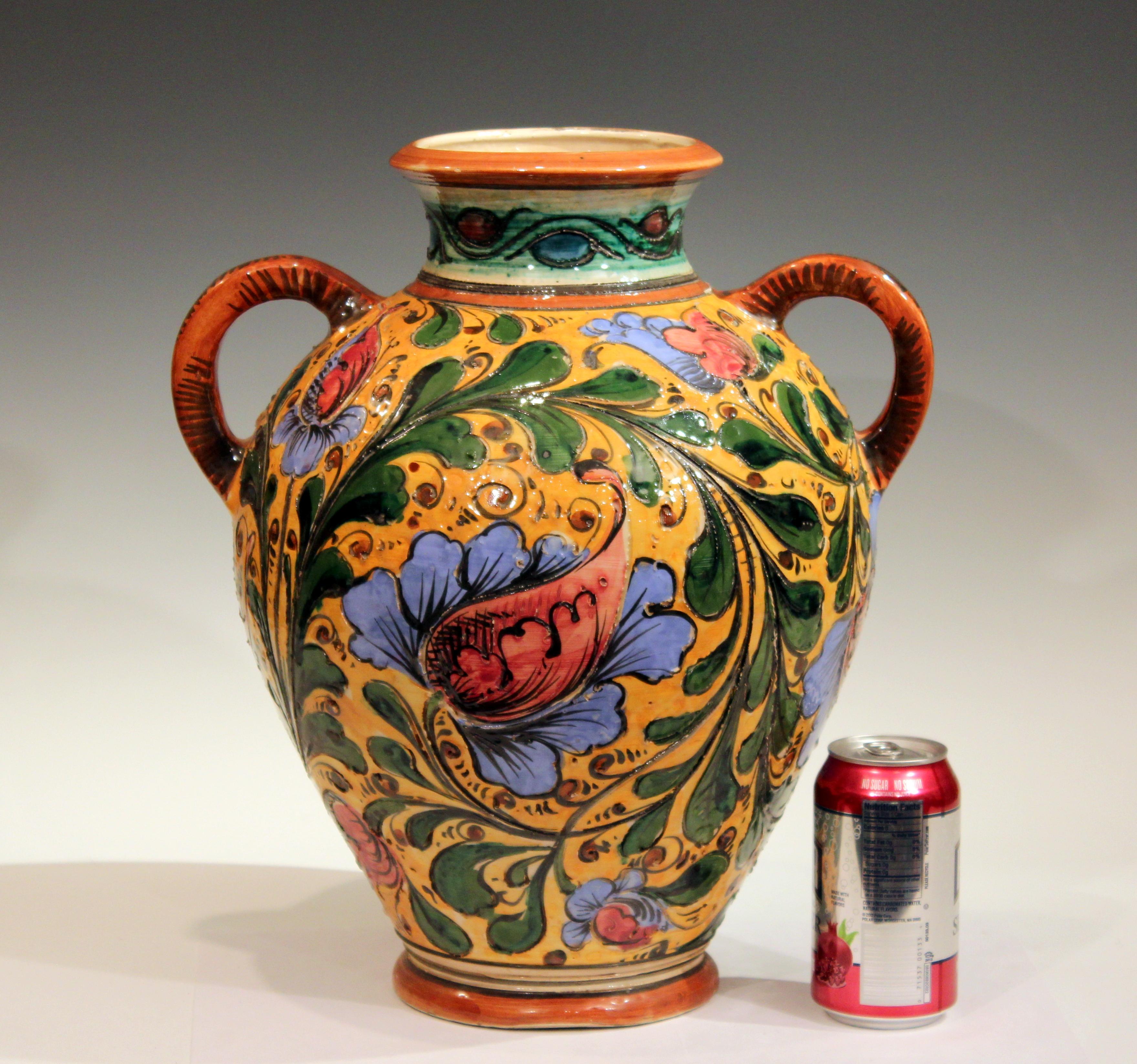 Large old or antique hand-turned Italian Pottery sgraffito Majolica vase with vibrant floral scrolls, circa early 20th century. Signed on base. 15 1/2