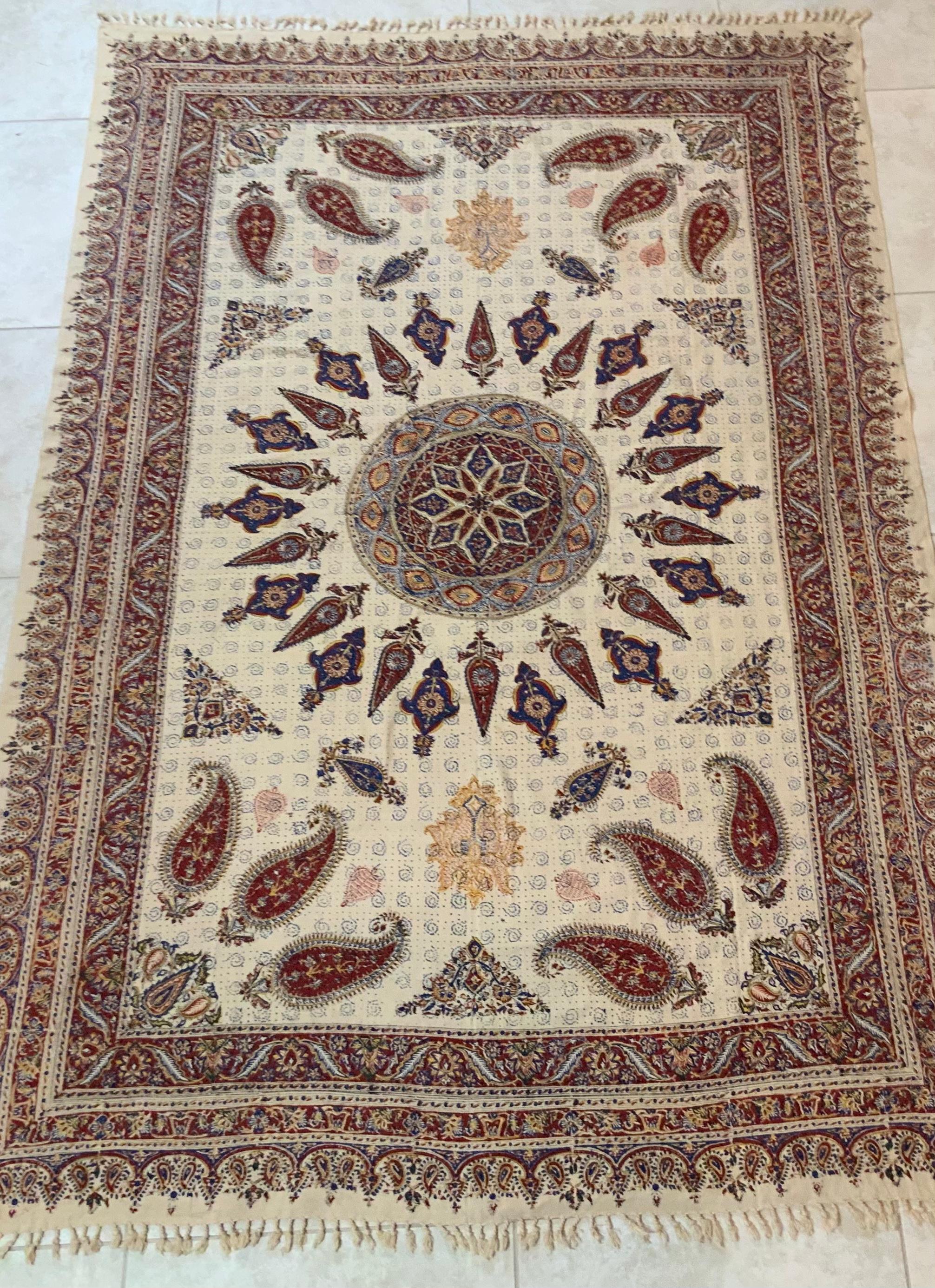 Large Old Persian textile from Isfahan Iran, with bothe paisley imprint motifs beautiful round center
with light blue red salmon colors on cream background.
Professionally cleaned and new silk backing.
Could use as tablecloth, wall hanging