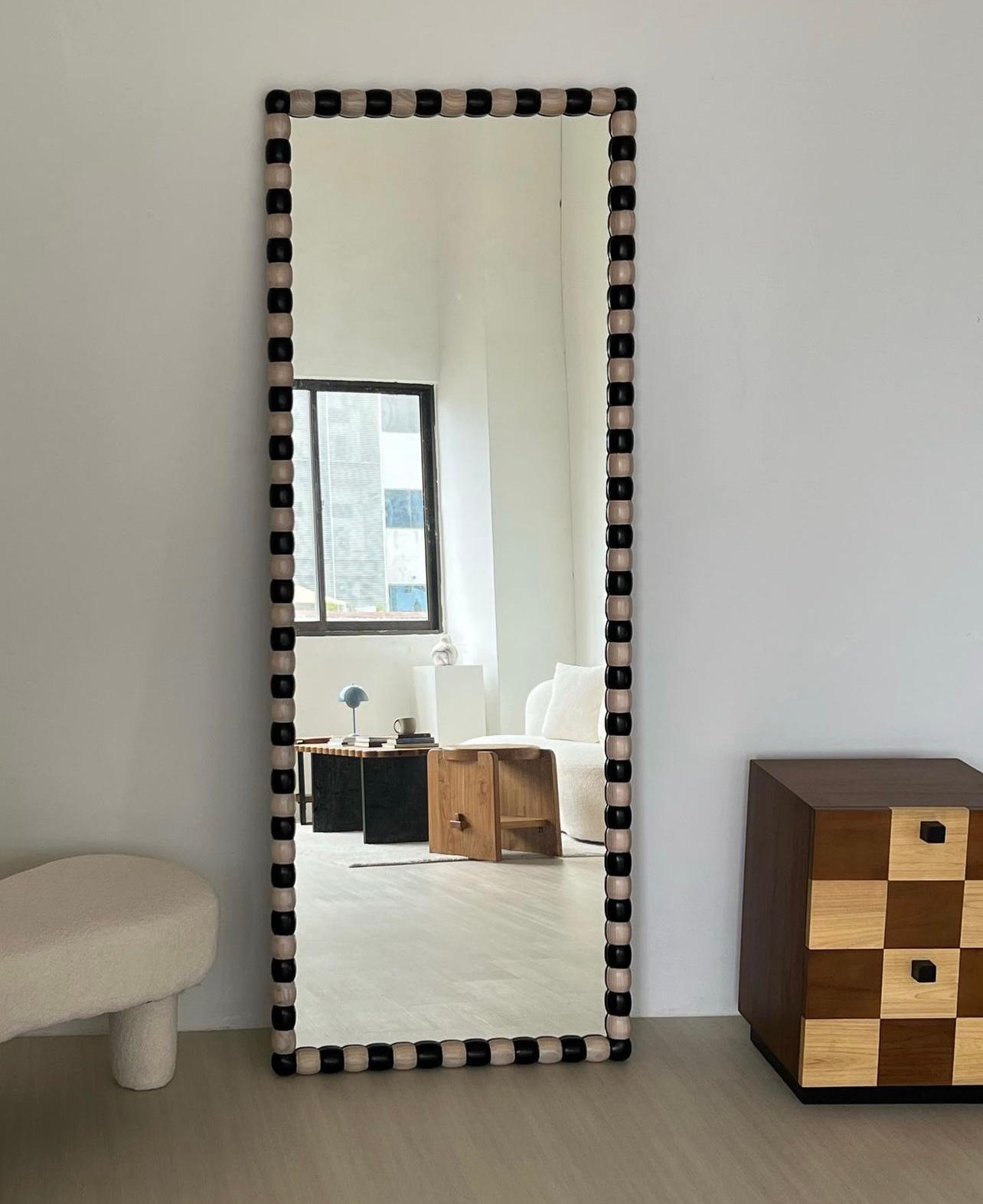 Large Onde Mirror by Studio Kallang
Dimensions: W 180 x D 5 x H 70 cm
Materials: Solid Sungkai. 

STUDIO KALLANG IS A SINGAPORE AND SEATTLE BASED PROJECT FOCUSING ON OBJECTS DESIGNED BY FAEZAH SHAHARUDDIN.
PIECES ARE PLAYFUL EXPLORATIONS IN FORM,