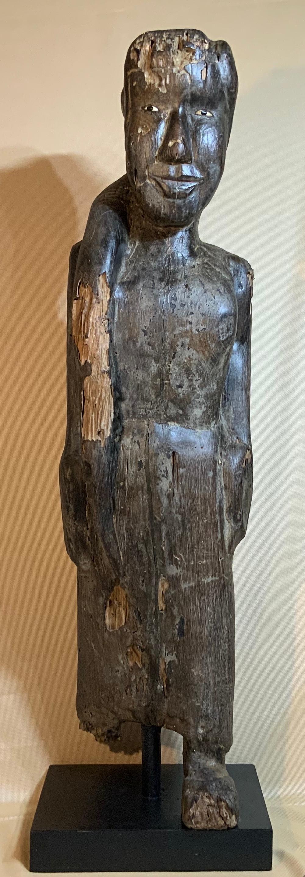Exceptional museum quality antique solid wood hand carving, of a beautiful female standing, looking forward, softness and gentleness
Facial expression. This wood sculpture is antique restored and maintained to degree we could, it had termites
