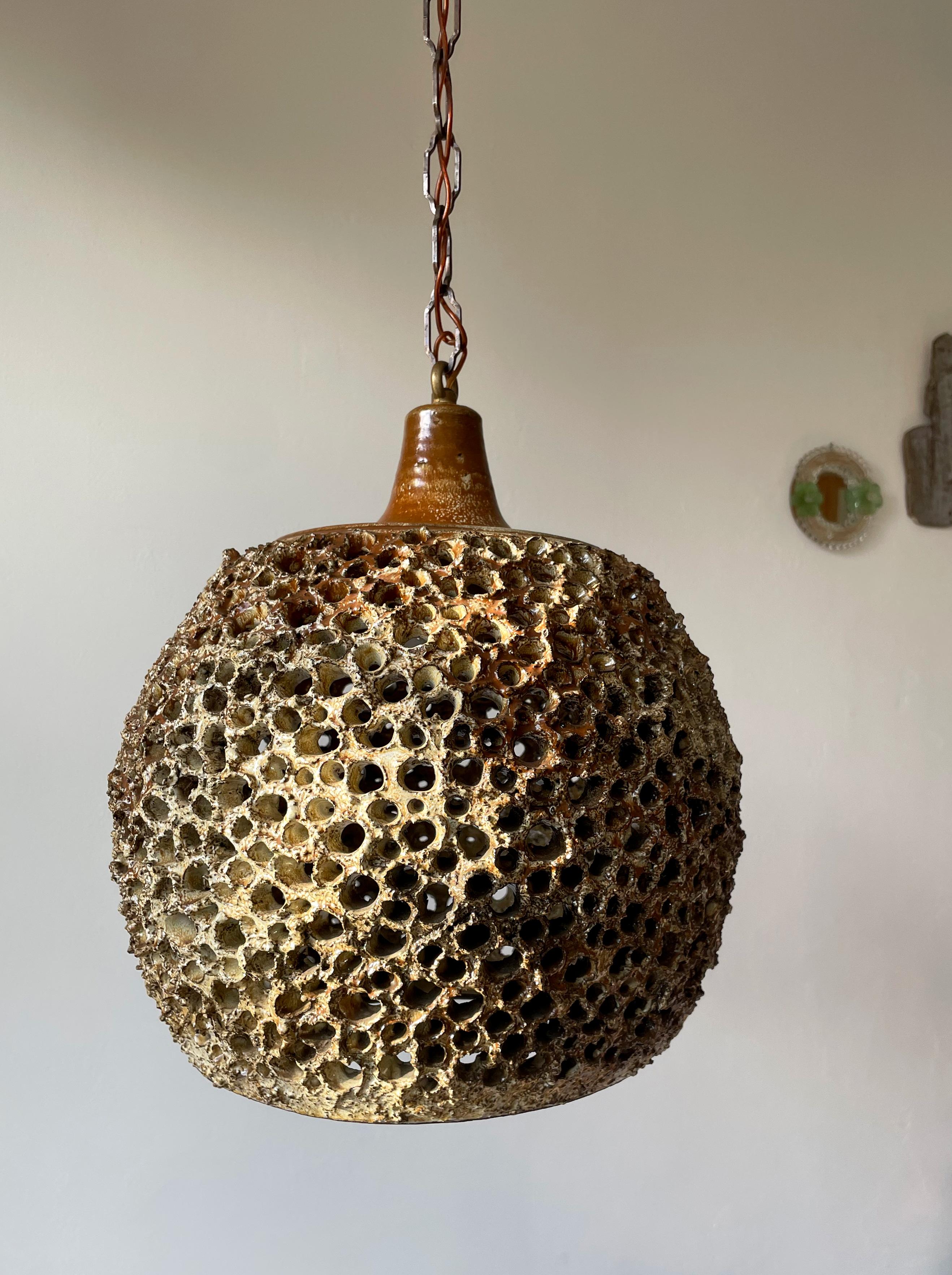 Large, unique and striking example of Scandinavian ceramic artistry! Danish Mid-Century Modern organically shaped, perforated ceramic pendant by Sejer Keramikfabrik. Manufactured on the Danish island of Funen in the 1960s as part of a limited