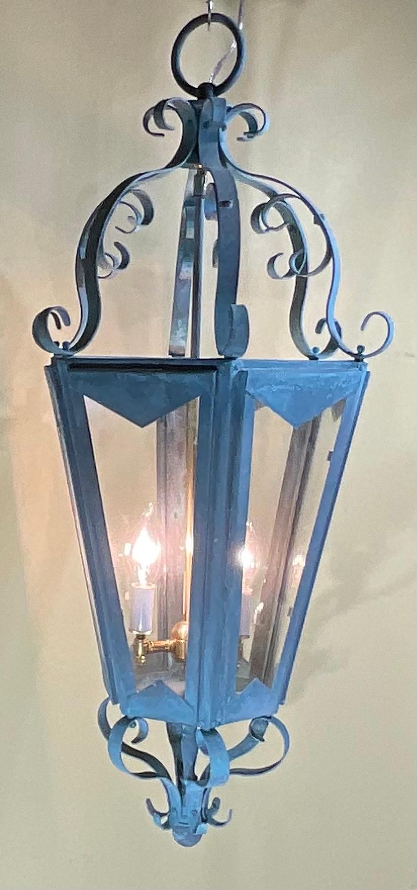 This is a beautiful One Of A King , large antique hanging lantern, crafted from solid copper and brass. The lantern's surface has developed a stunning natural verdigris patina, showcasing its age and authenticity. Its classic design and robust