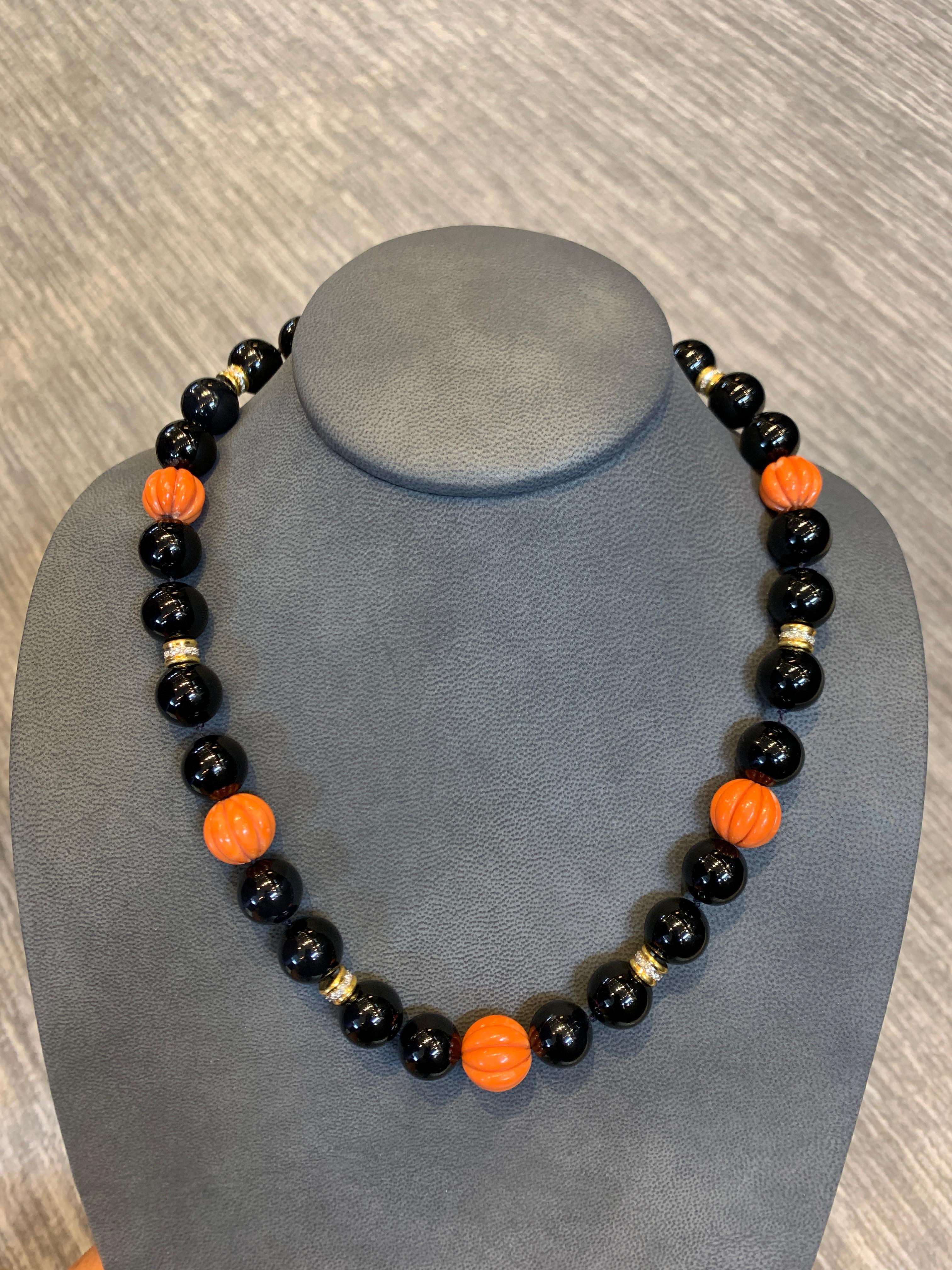 Large Onyx &  Carved Coral Bead & Diamond Necklace 
Black Onyx Bead & Carved Coral Bead with 6 gold & Diamond Spacers
Length: 21