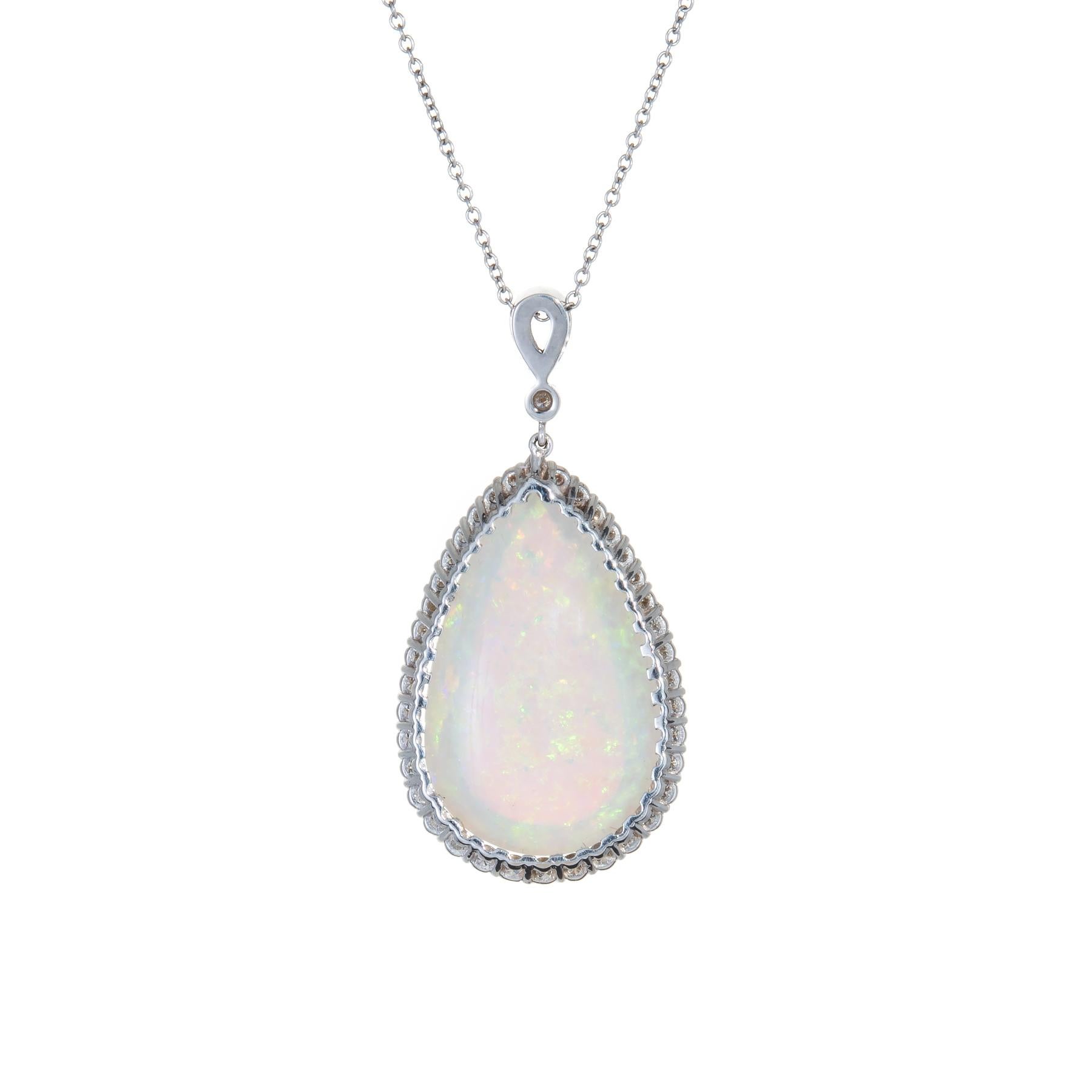 Finely detailed gemstone necklace, crafted in 14 karat white gold.  

Cabochon cut Pear shaped natural opal measures 30mm x 19mm (estimated at 25.69 carats), accented with an estimated 2.25 carats of diamonds (estimated at G-H color and VS2-SI1