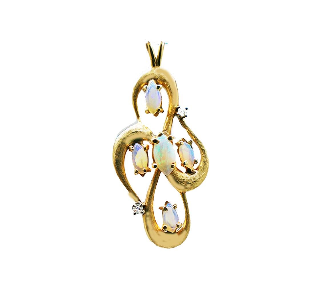 Large Opal Freeform Diamond Pendant. 
 gold pendant weighing 5.6 grams of 14 karat yellow gold features colorful marquise shaped opals. The stone are measuring 6.00-7.5 mm in length and have exciting colors as you move the pendant to the lighting