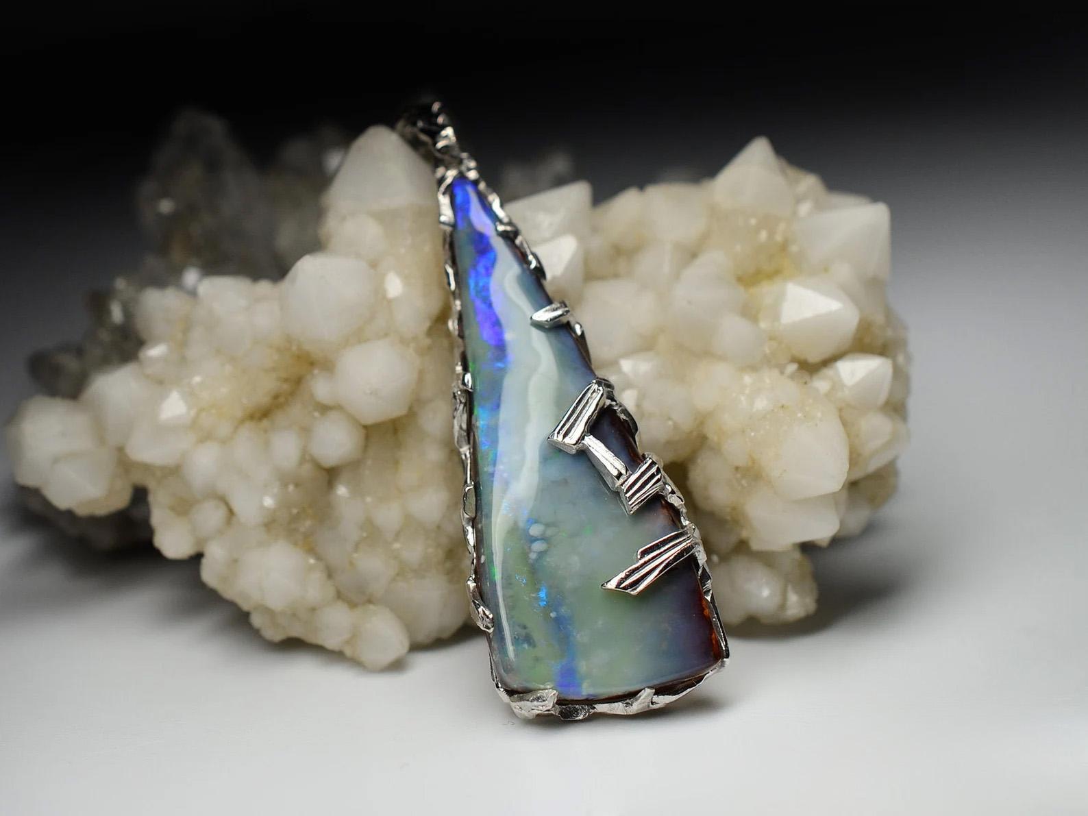 Silver pendant with natural Boulder Opal 
opal origin - Australia
opal measurements - 0.16 x 3,94 x 1,57 in / 4 x 15 x 40 mm
stone weight - 22.70 carat
pendant lenght - 51 mm
pendant weight - 7.78 grams